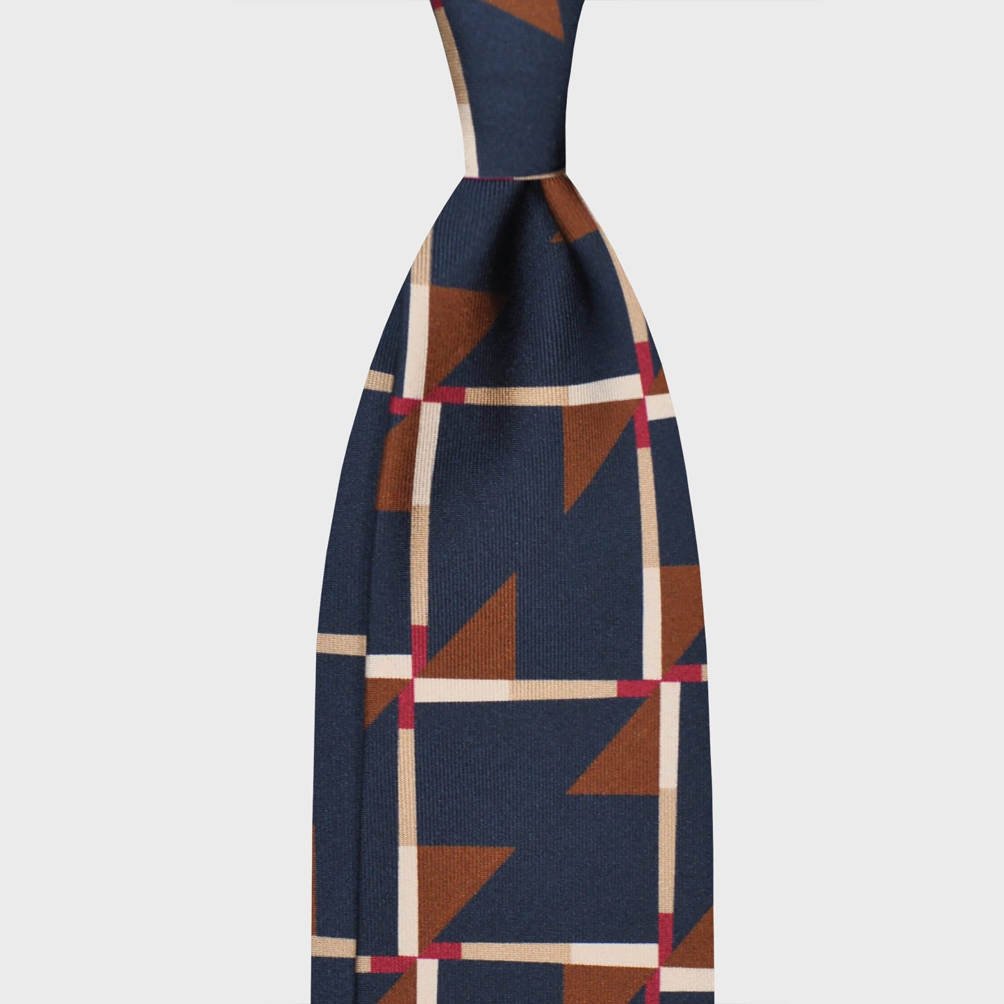 Cobalt Blue Art Decò Pattern Silk Tie. Refined deco tie made with finest Italian silk soft to the touch, cobalt blue background with caramel brown and red Art Decò pattern, unlined tie 3 folds, this Art Deco ties is made with a exclusive pattern made by Wools Boutique Uomo