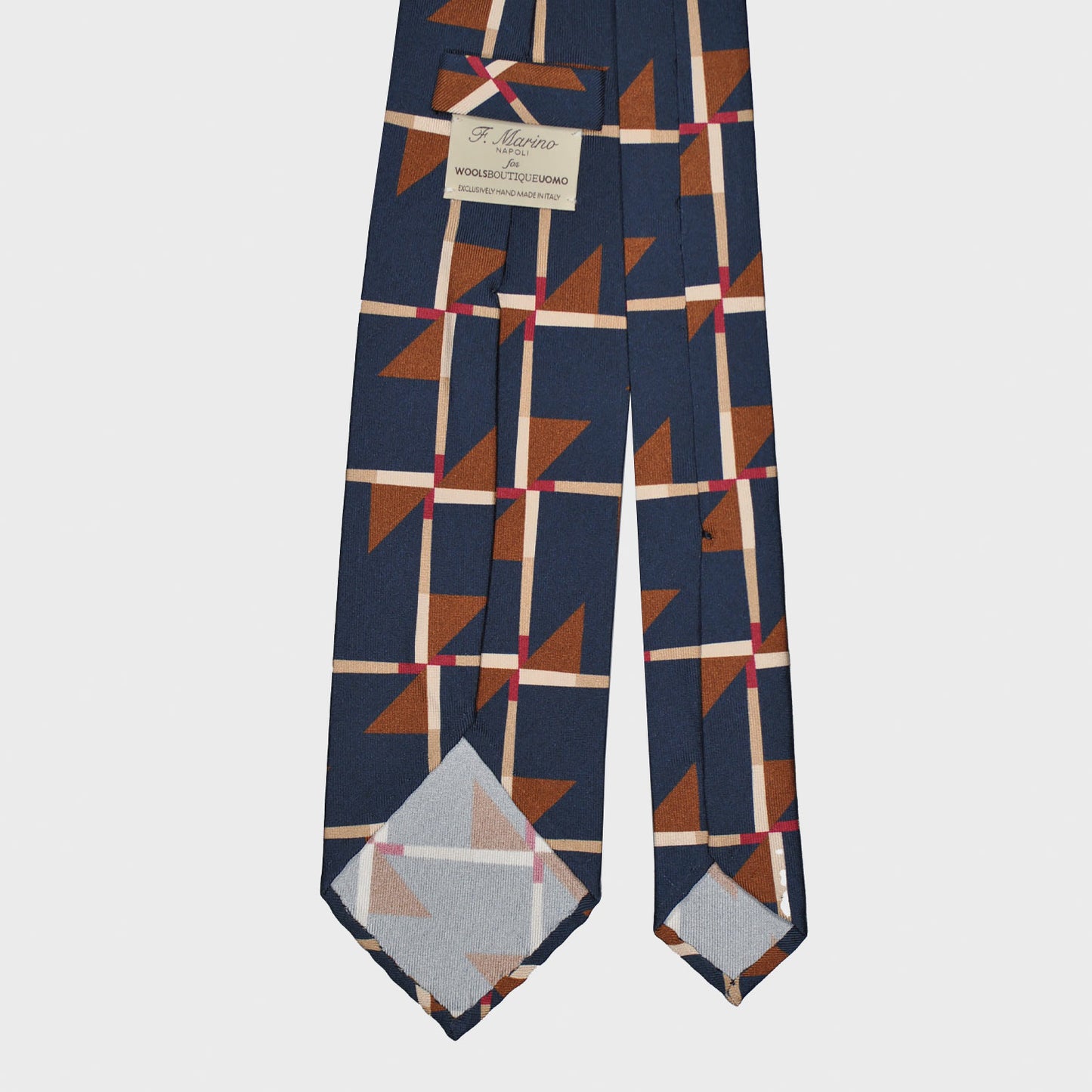 Refined deco tie made with finest Italian silk soft to the touch, cobalt blue background with caramel brown and red Art Decò pattern, unlined tie 3 folds, this Art Deco ties is made with a exclusive pattern made by Wools Boutique Uomo