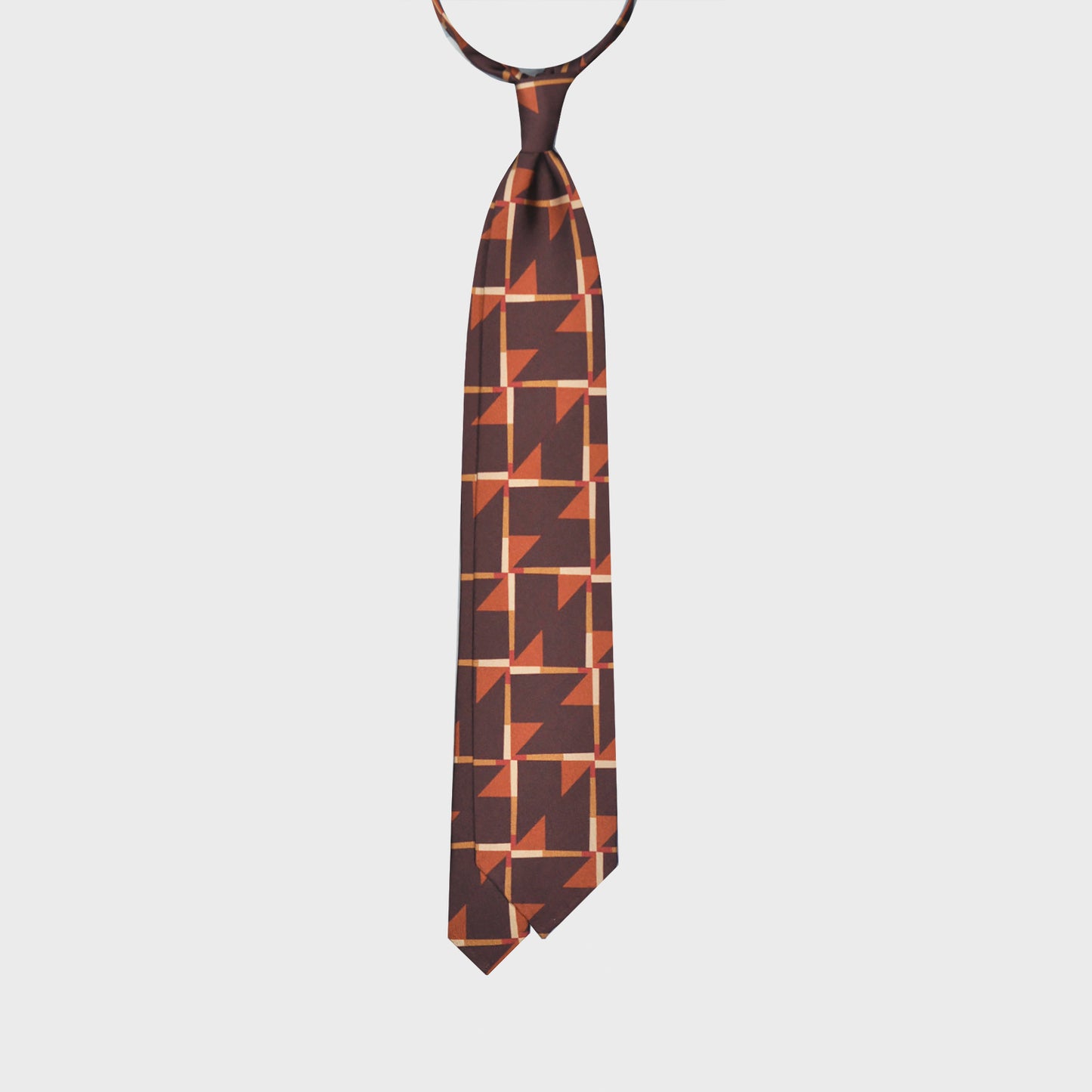 Refined deco tie made with finest Italian silk soft to the touch, coffee brown background with orange and ocra Art Decò pattern, unlined tie 3 folds, this Art Deco ties is a exclusive pattern made by Wools Boutique Uomo