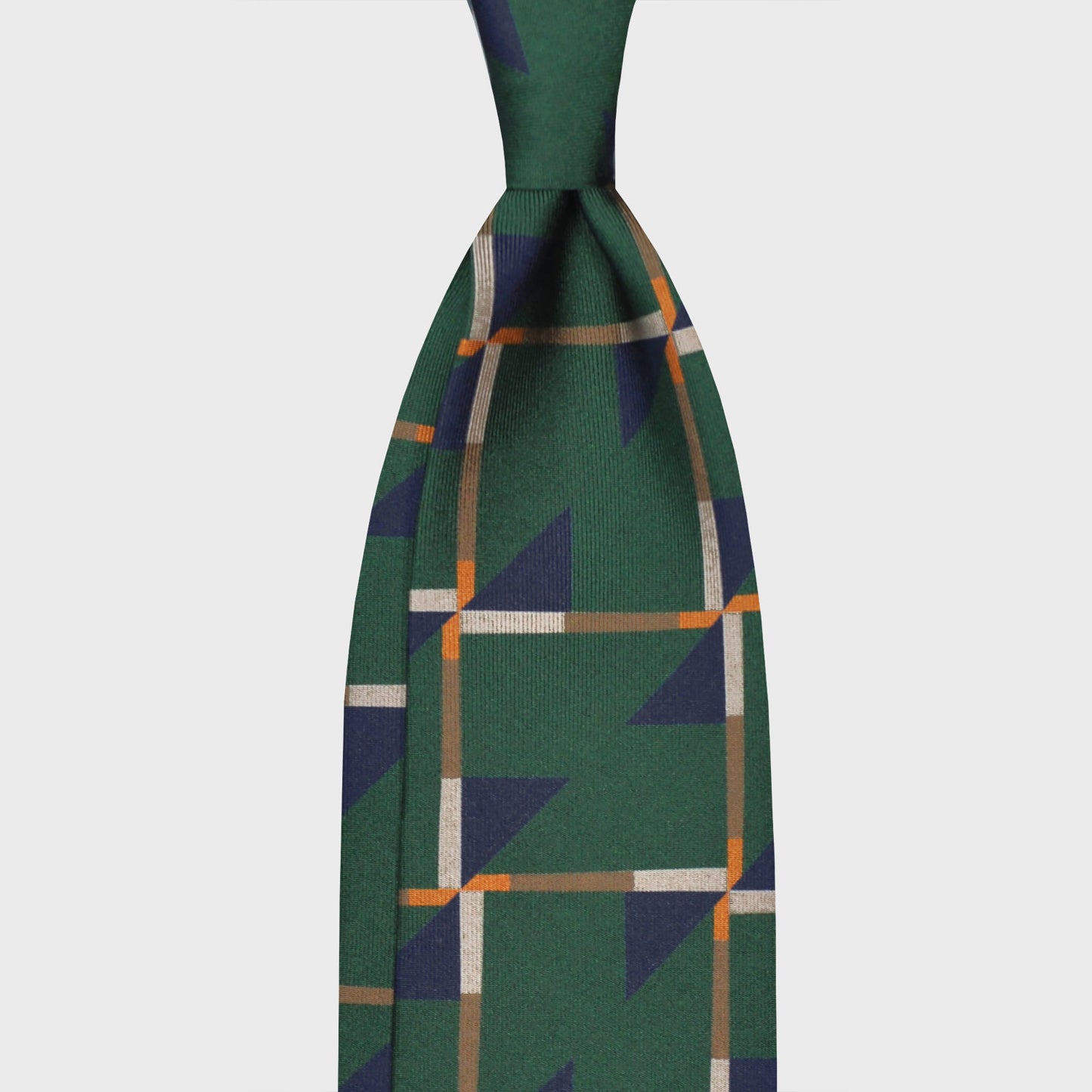 Grass Green Art Decò Pattern Silk Tie. Refined deco tie made with finest Italian silk soft to the touch, grass green background with cobalt blue and beige Art Decò pattern, unlined tie 3 folds, this Art Deco ties is made with a exclusive pattern made by Wools Boutique Uomo