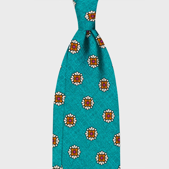 Turquoise Silk Tie Unlined Diamonds Flower Pattern. Silk tie flamed turquoise background with curry yellow and white diamonds flower pattern, unlined 3 folds, handmade tie F.Marino Napoli for Wools Boutique Uomo
