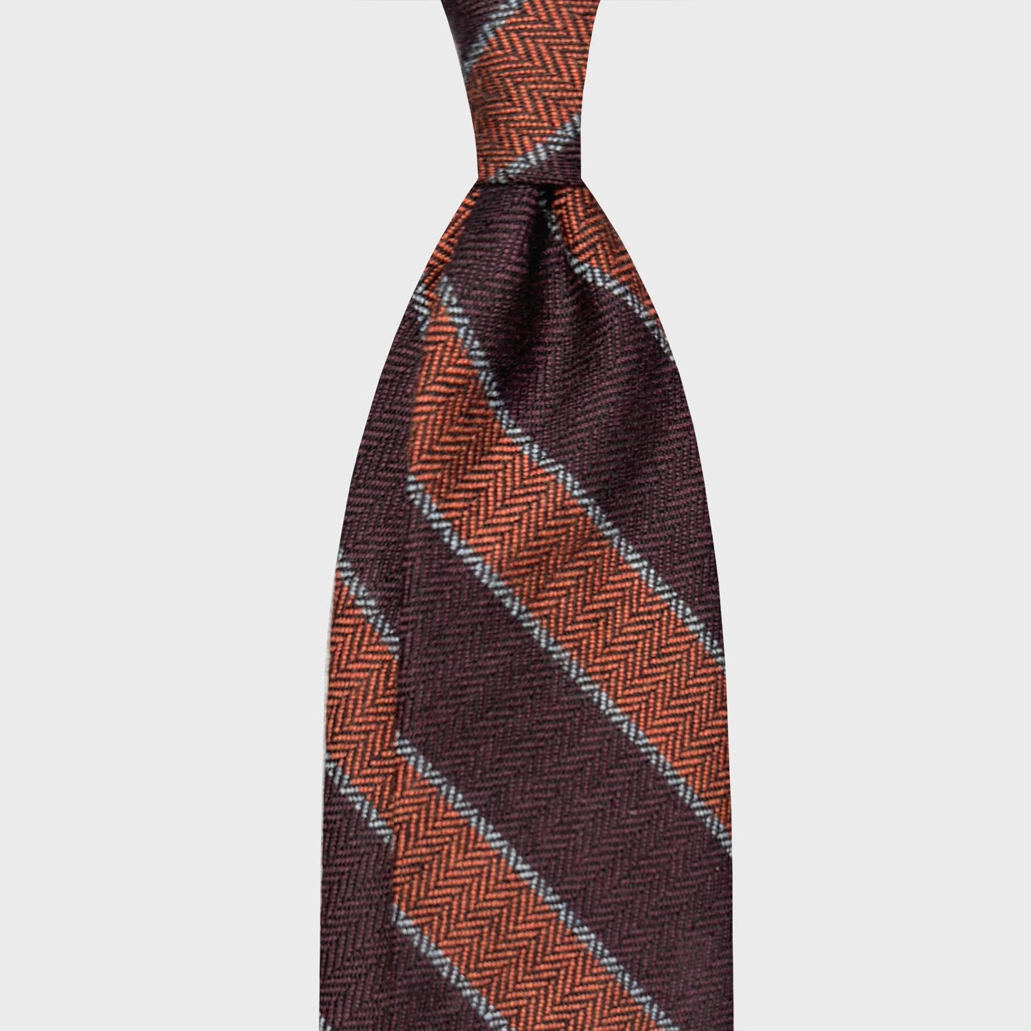 Purple Wine Striped Wool Tie. Regimental wool tie unlined and soft to the touch, striped purple wine and orange, F.Marino Napoli exclusive handmade striped tie for Wools Boutique Uomo 