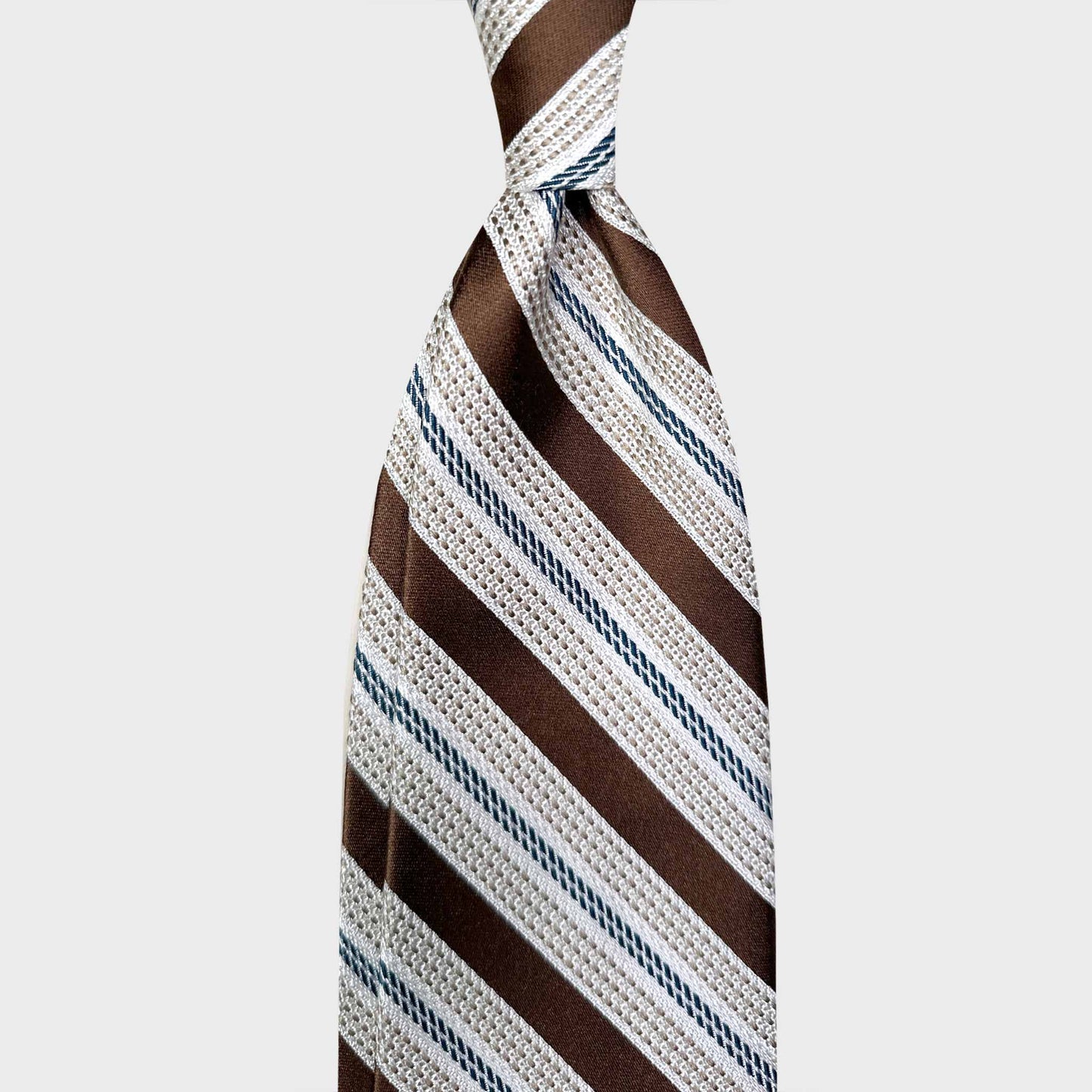 Elegant Multi Striped Tie Grenadine And Satin Silk. Exclusive multi striped tie made with grenadine and satin silk, ivory white and coffee brown multi striped ties, discover at the men's ties shop in Geneva