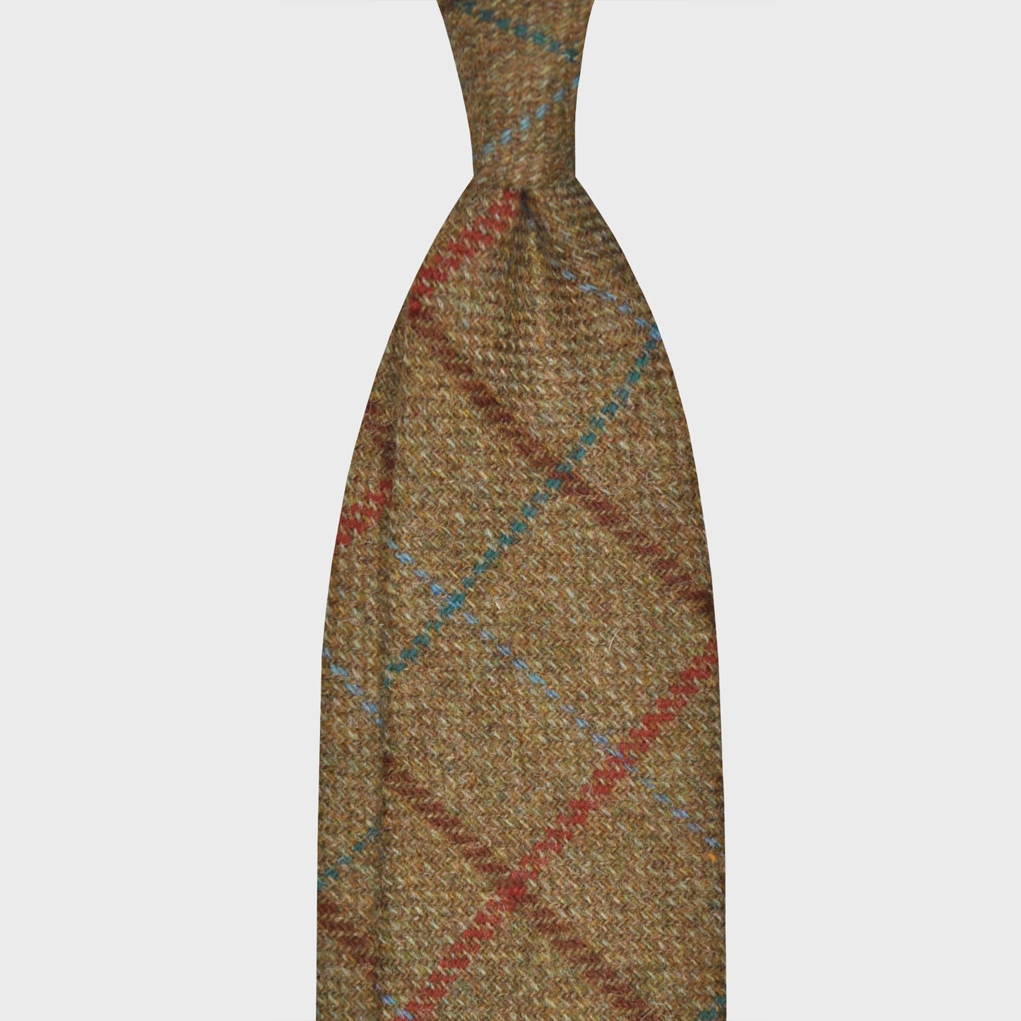 Clay Brown Tweed Tie Windowpane Multicolor. Timeless tweed tie, wool texture to the touch bristly feeling, unlined tie handmade in Italy by F.Marino Napoli exclusive for Wools Boutique Uomo, clay brown background, multicolor windowpane pattern