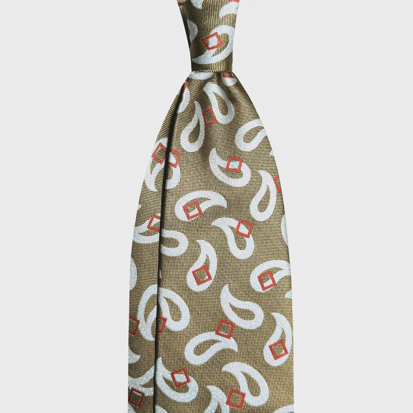 Greyish Large Paisley Silk Tie Italian Elegance Geneva. Discover this Greyish Large Paisley silk tie at Wools Boutique Uomo Geneva. Handmade in Italy with refined colours for timeless sartorial style.