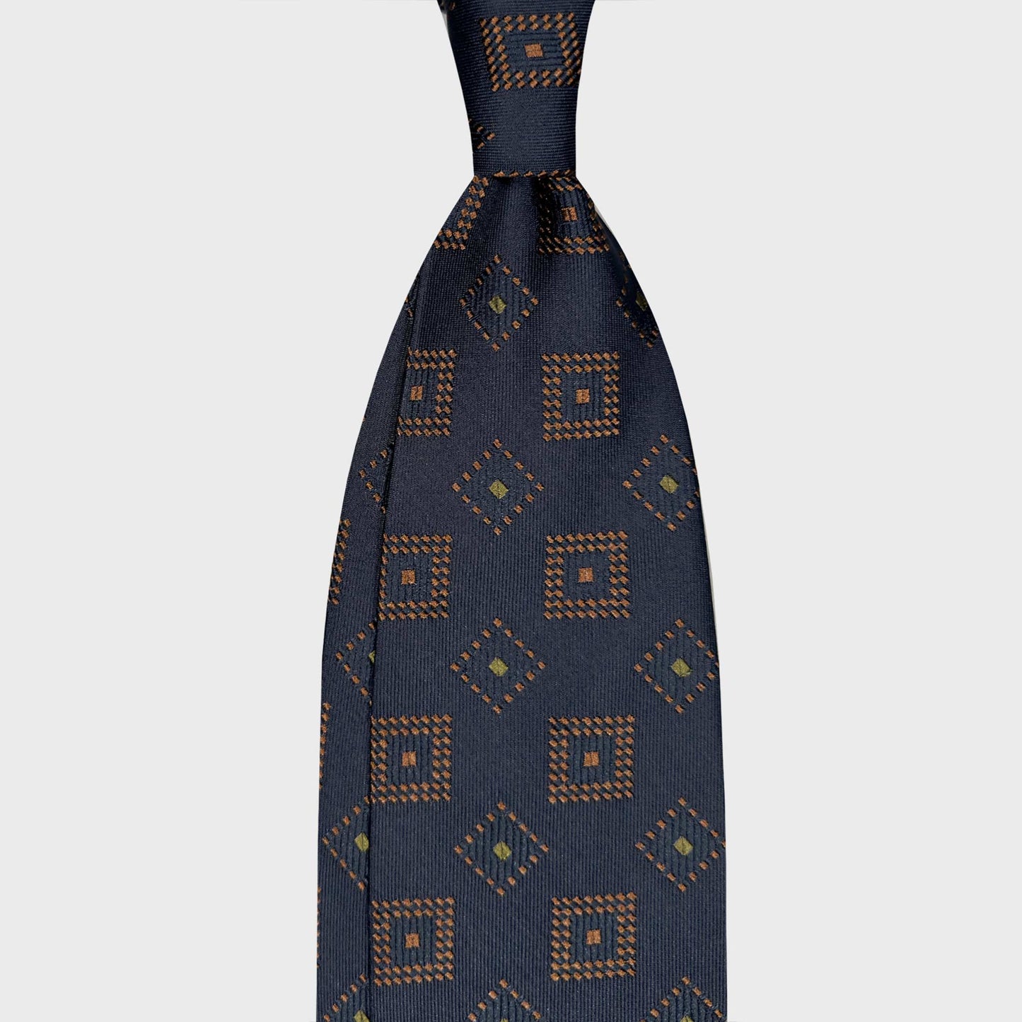 Navy Blue Silk Tie Medallions Pois Pattern Handmade in Italy. Elegant navy blue silk tie with medallions pois pattern. Discover at Wools Boutique Uomo ties store in Geneva for refined and contemporary classic style.