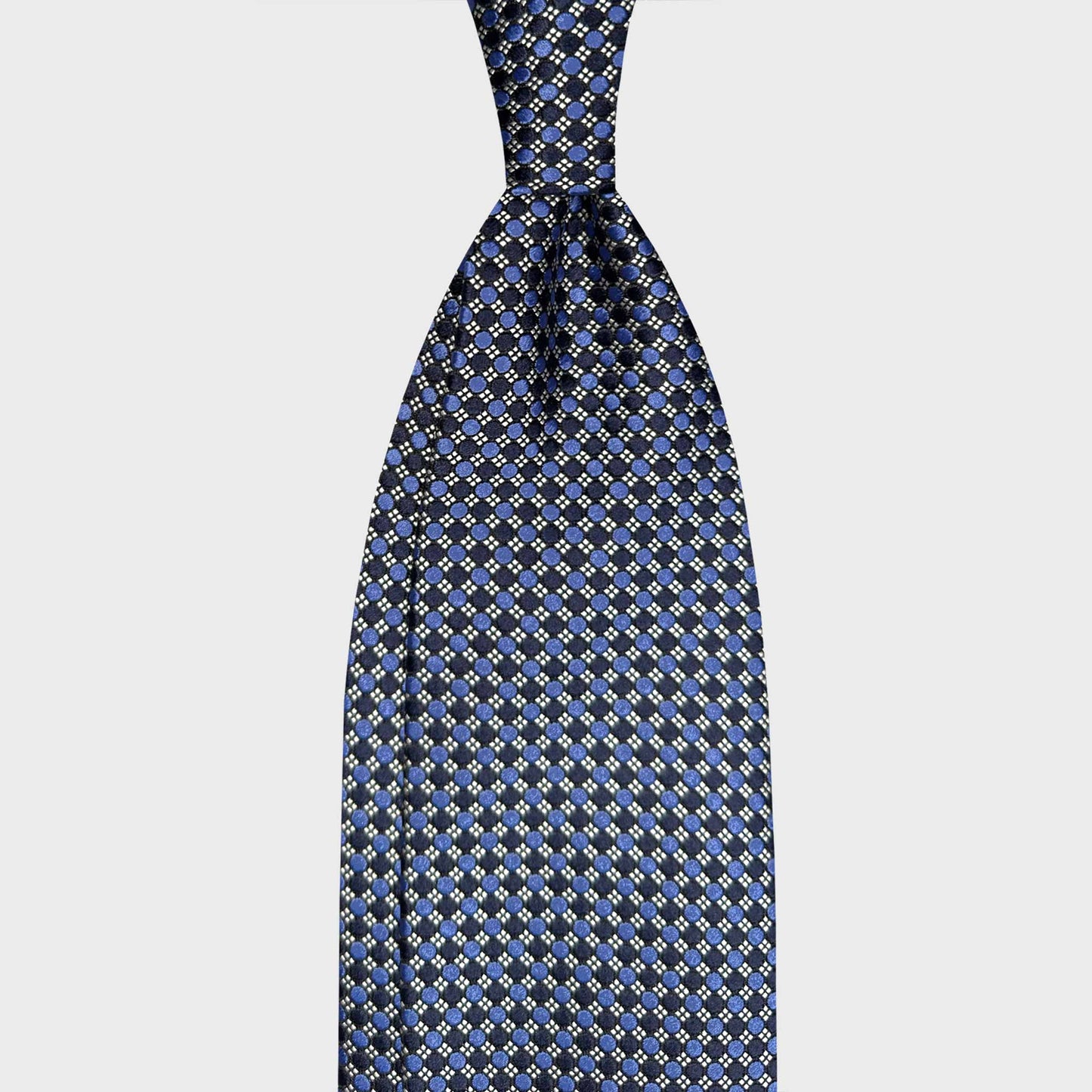 Made in Italy Silk Tie Classic Navy Blue Micro Grid Pattern. Elegant navy blue silk tie with refined micro grid pattern. Handmade in Italy and curated by Wools Boutique Uomo Geneva for sophisticated business formal looks.