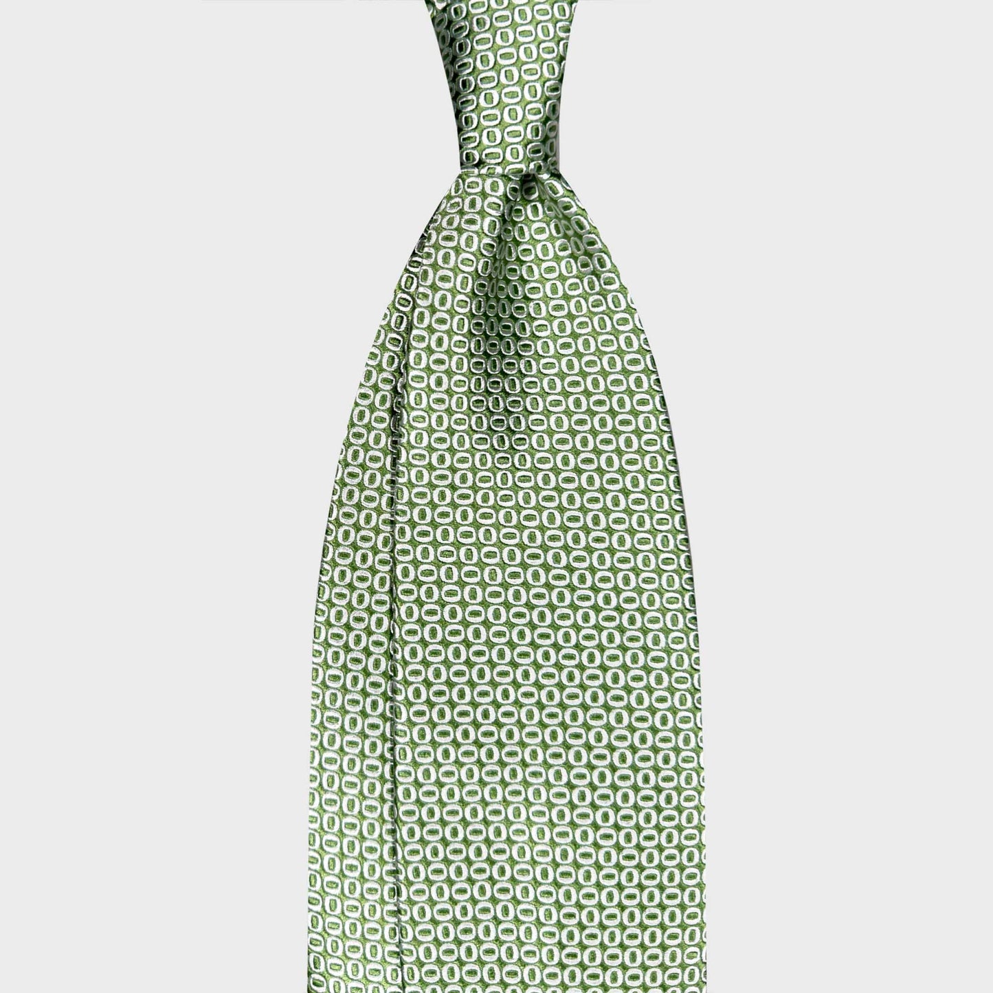 Silk Tie Shop Switzerland Micro Oval Pattern Art Deco Lime Green Tie. Elegant lime green silk tie with refined micro oval pattern. Handmade Italian tie curated by Wools Boutique Uomo Geneva for distinctive modern style.
