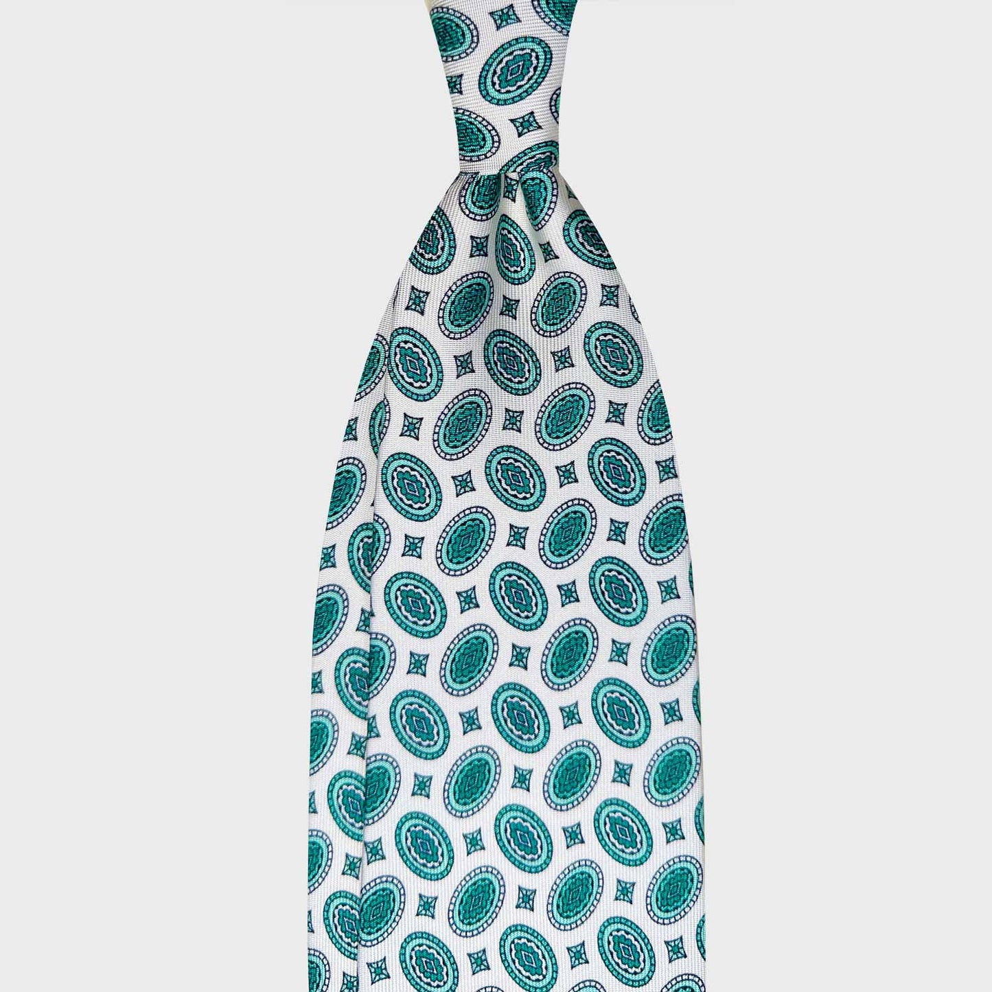 White Silk Tie Oval Diamonds Hand Made in Italy. Elegant white silk tie with water green oval diamonds pattern, handmade tie shop Wools Boutique Uomo Geneva
