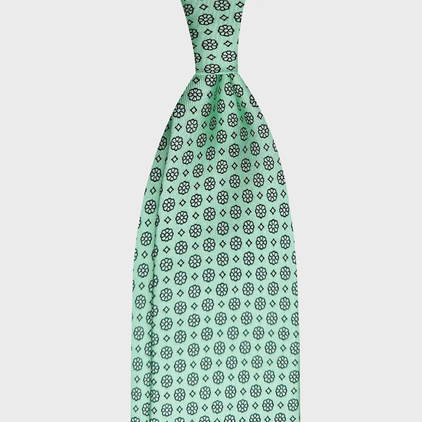 Mint Green Silk Tie Classic Micro Daisy Pattern. Elegant silk tie light mint green background with black micro daisy pattern, unlined 3 folds, handmade tie F.Marino Napoli for Wools Boutique Uomo Genève