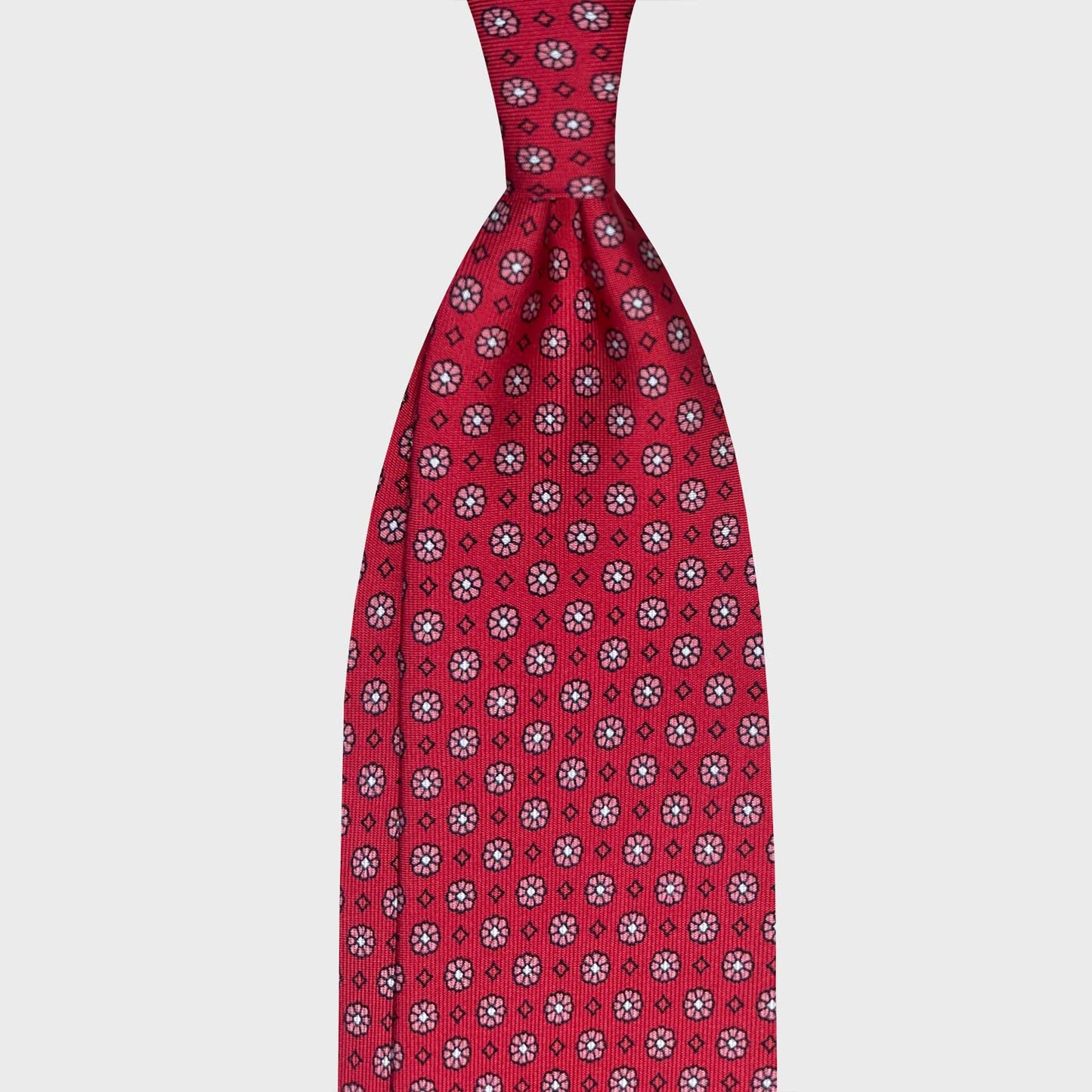 Chili Pepper Red Silk Tie Classic Micro Daisy Pattern Genève. Iconic red silk tie chili pepper background with black micro daisy pattern, unlined 3 folds, handmade tie F.Marino Napoli for Wools Boutique Uomo Geneva