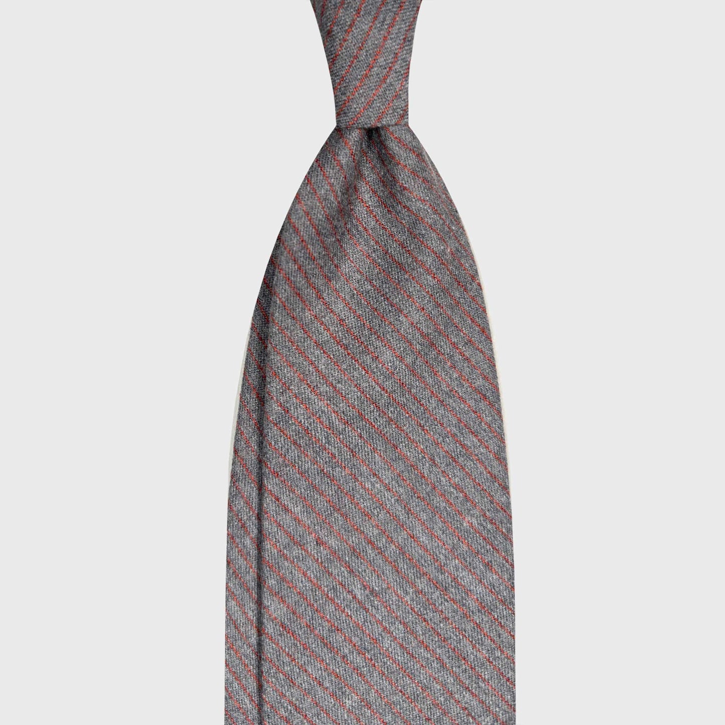 Steel Grey Wool Tie Classic Burgundy Striped. Refined grey wool ties available at men's ties store Geneva Wools Boutique Uomo, elegant and soft touch texture, steel grey and burgundy red striped