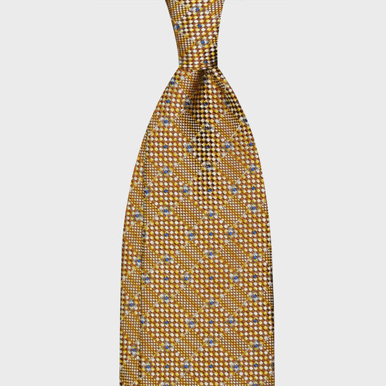 Yellow Gold Canvas Texture Silk Tie. Silk tie made with canvas texture, a refined cross of yellow gold, caramel brown, white, light blue. Handmade tie F.Marino Napoli exclusive for Wools Boutique Uomo, unlined hand rolled edge