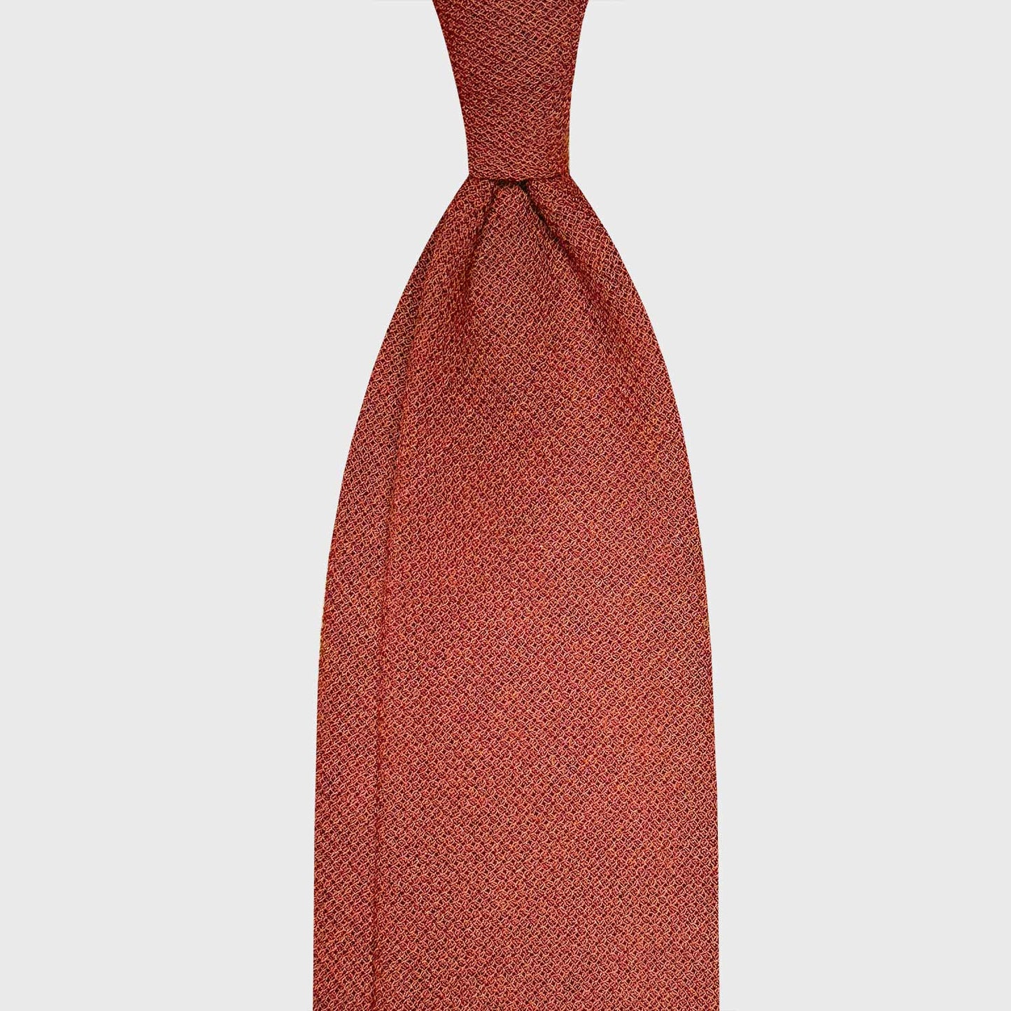 Orange Wool Hopsack Tie Handmade Italian. Classic wool tie made with soft hopsack wool, orange rust plain color, handmade tie collection Wools Boutique Uomo Geneva, ideal for outfits 4 season