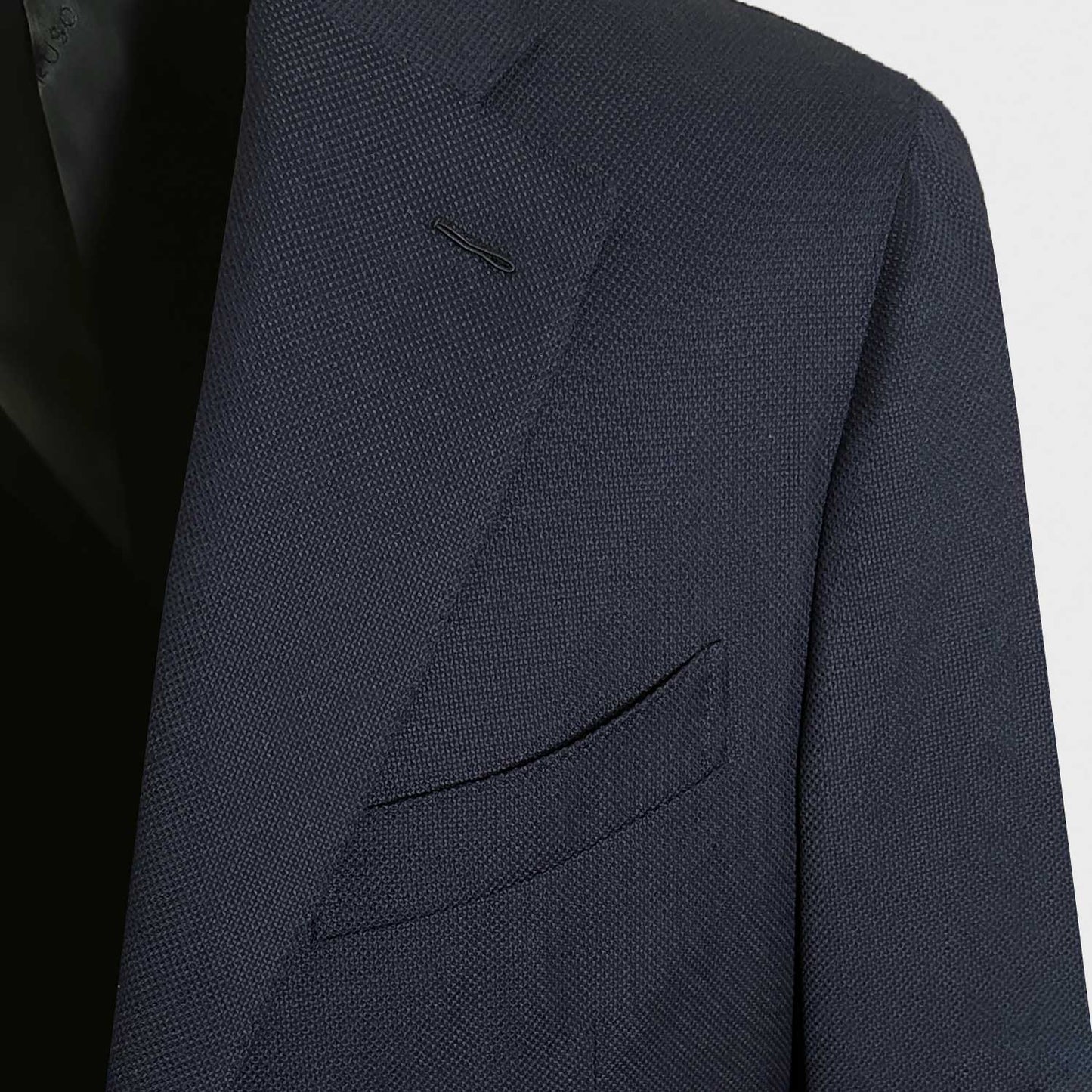 Men's navy hopsack blazer made in Italy by Caruso exclusively for Wools Boutique Uomo. This Caruso tailored wool hopsack jacket features classic fit with slightly structured profile, model Boheme not short classic fit, unlined, perfect for both formal occasions and smart casual outfit.