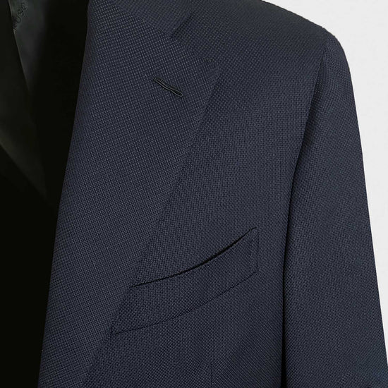 Men's navy hopsack blazer made in Italy by Caruso exclusively for Wools Boutique Uomo. This Caruso tailored wool hopsack jacket features classic fit with slightly structured profile, model Boheme not short classic fit, unlined, perfect for both formal occasions and smart casual outfit.