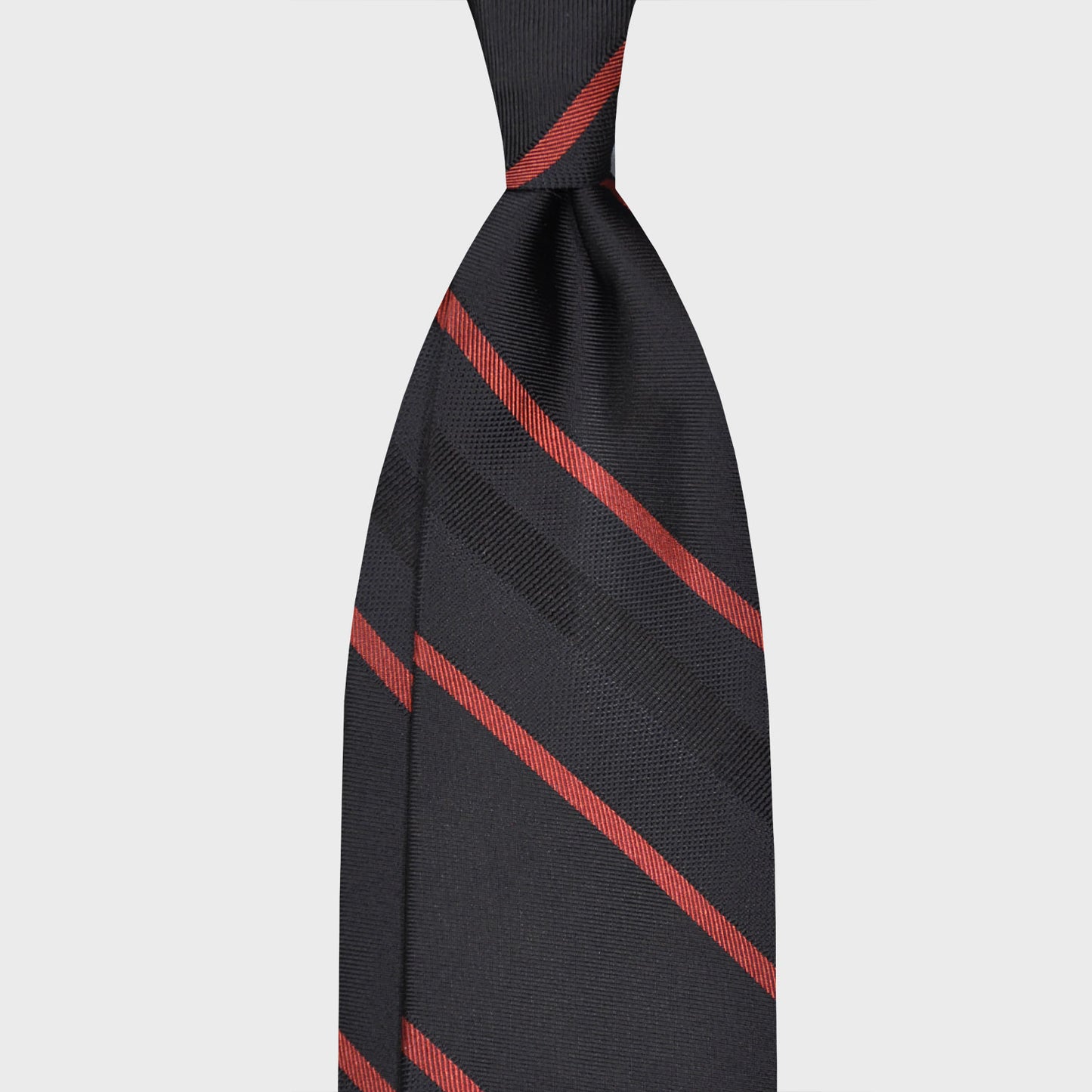 Black Silk Necktie Striped. Elegant striped silk tie, refined black background with lobster red striped, handmade in Italy by F.Marino Napoli exclusive for Wools Boutique Uomo, unlined regimental necktie 3 folds hand rolled edge.