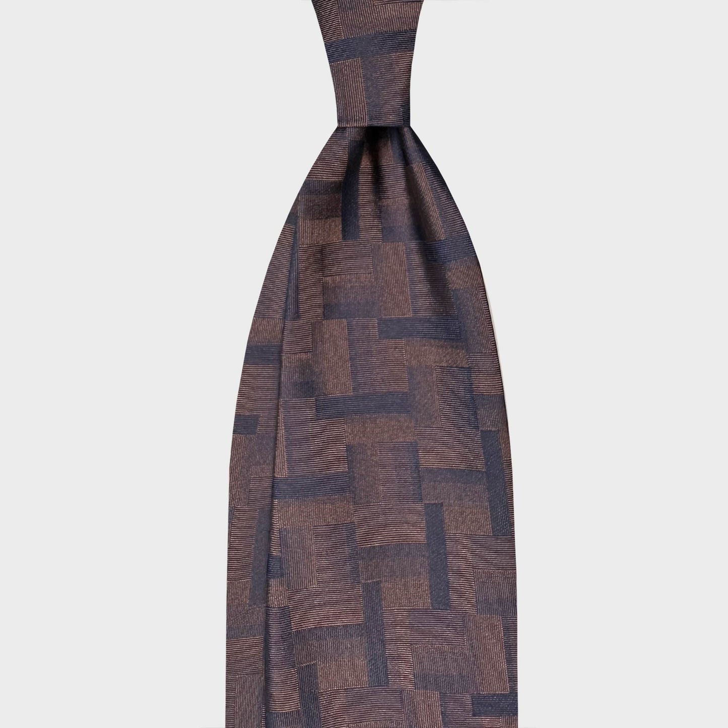 Coffee Brown jacquard Silk Tie Geometry Patchwork Pattern Navy. Coffee brown silk tie featuring a geometric patchwork pattern in dark navy tones. A refined jacquard design with architectural character, ideal for contemporary business and elegant formal menswear. 