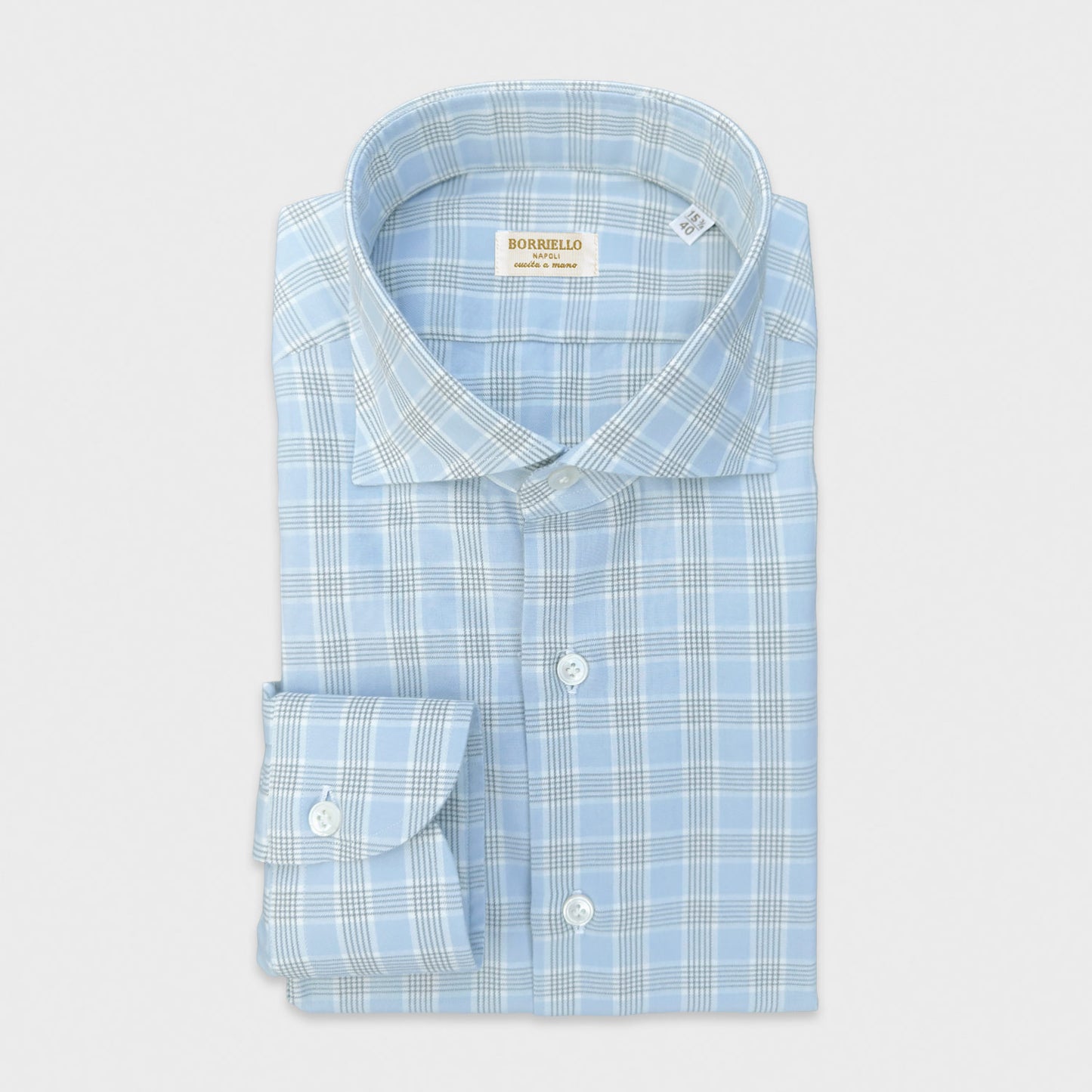 Light Blue Soft Cotton Flannel Windowpane Shirt Hand Made in Italy. Refined cotton flannel with a elegant light blue windowpane pattern, hand made in Italy exclusively in Wools Boutique Uomo men's tailoring shirts in geneva