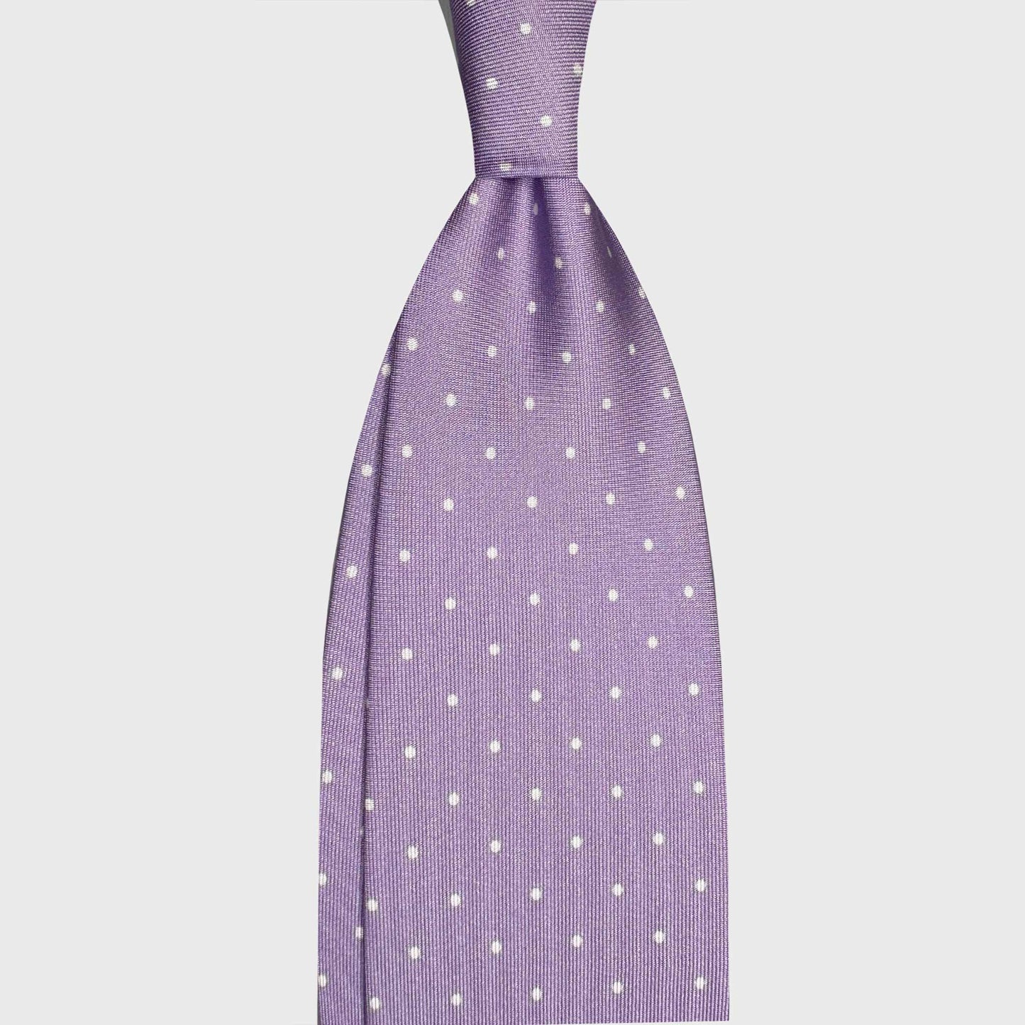 Light Violet Pois Men's Ties Geneva Switzerland. Violet polka dot silk tie, designed by Wools Boutique Uomo, handmade in Italy. Ideal for refined tailoring clothing, business attire and elegant menswear.