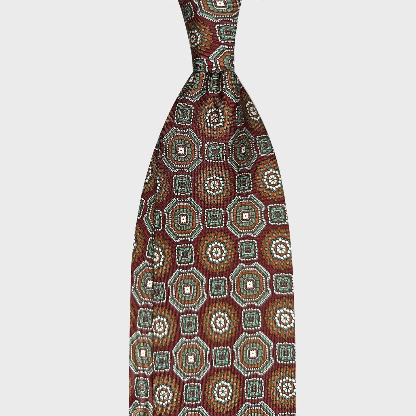 Rust Brown Maiolica Pattern Silk Men's Tie Handmade in Italy. Discover Wools Boutique Uomo ties, refined Italian ties Geneva and luxury sartorial accessories for elegant wardrobes.
