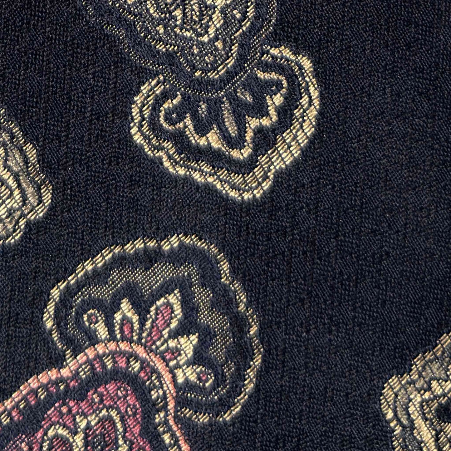 Ornamental medallion silk tie detail dark navy gold pink.