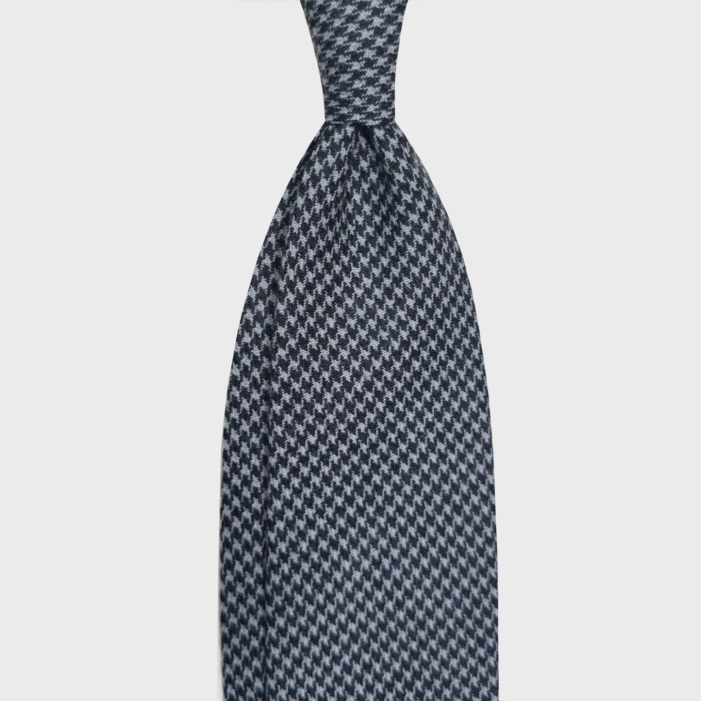 Black Grey Pied de Poule Wool Tie Men's Store Geneva Switzerland. Timeless black grey pied-de-poule wool tie, unlined ties handmade in Italy available at men's store Geneva Switzerland Wools Boutique Uomo