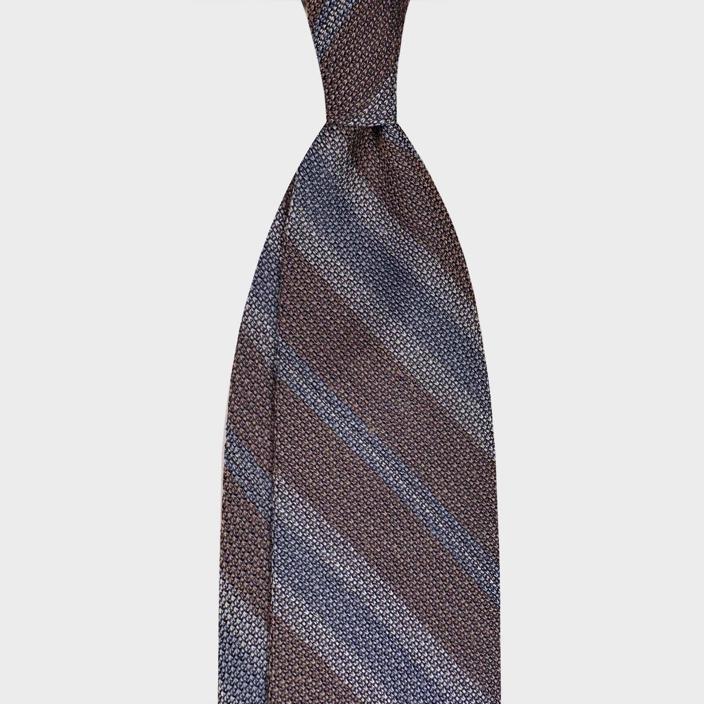 Handmade F.Marino grenadine silk regimental tie in mushroom taupe with sky blue and silver stripes. Crafted in Naples and available at Wools Boutique Uomo Geneva.