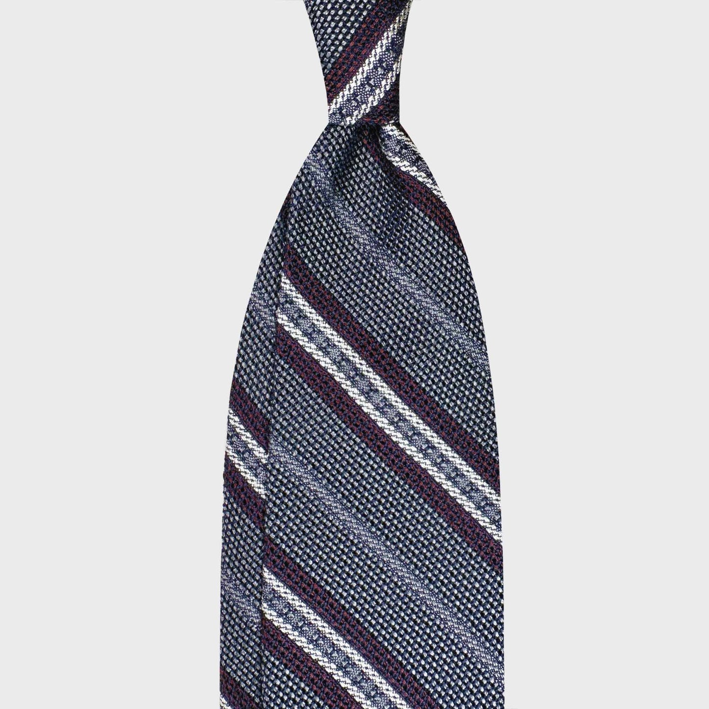 Handmade F.Marino grenadine silk regimental tie in iron grey with silver and burgundy stripes. Crafted in Naples for Wools Boutique Uomo Geneva.