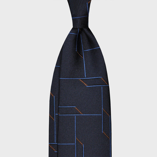Navy Blue Partridge Eye Silk Tie 3D Geometric Pattern. Handmade tie made with soft partridge eye silk, unlined hand rolled edge 3 folds, navy blue color background, F.Marino Napoli ties exclusive handmade in Italy for Wools Boutique Uomo  