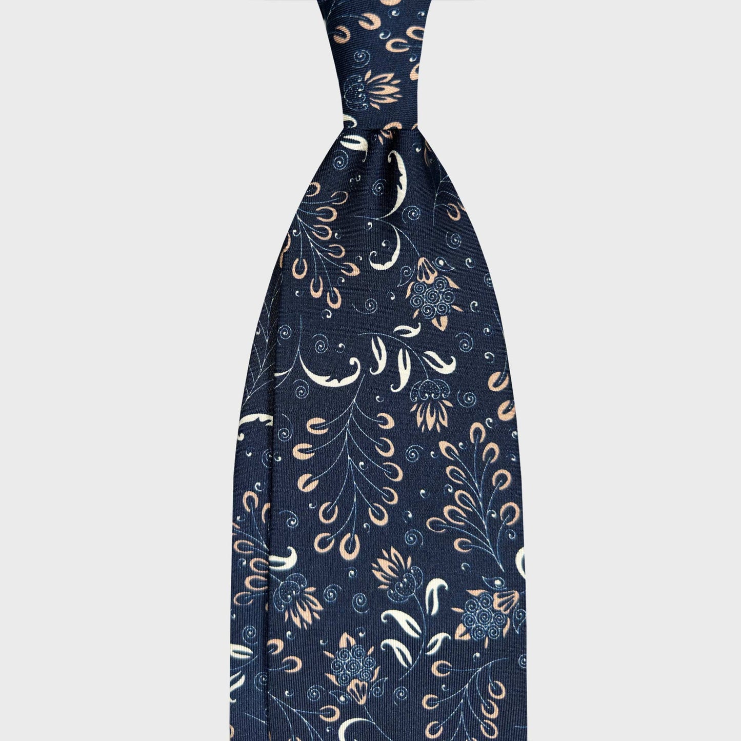 Navy Blue Liberty Silk Tie Wools Boutique Uomo Geneva. Refined navy blue silk tie with a refined Liberty inspired botanical pattern. A sophisticated accessory for timeless tailoring and formal wear.