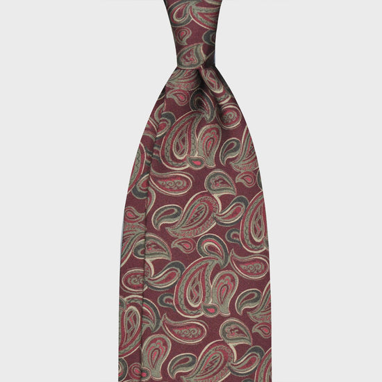 Burgundy Paisley Silk Tie Handmade Drawing. Paisley pattern silk tie made with a refined handmade drawing paisley with burgundy red backgound, handmade tie F.Marino Napoli exclusive for Wools Boutique Uomo, unlined hand rolled edge