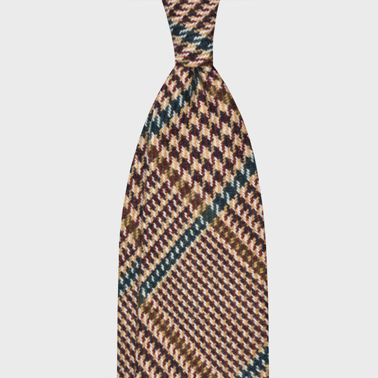 Petrol Green Wool Tweed Gun Club Unlined Handmade Tie. Tweed wool tie, F Marino ties for Wools Boutique Uomo, light tweed soft texture to the touch, 3 folds, camel and coffee brown background, petrol green windowpane