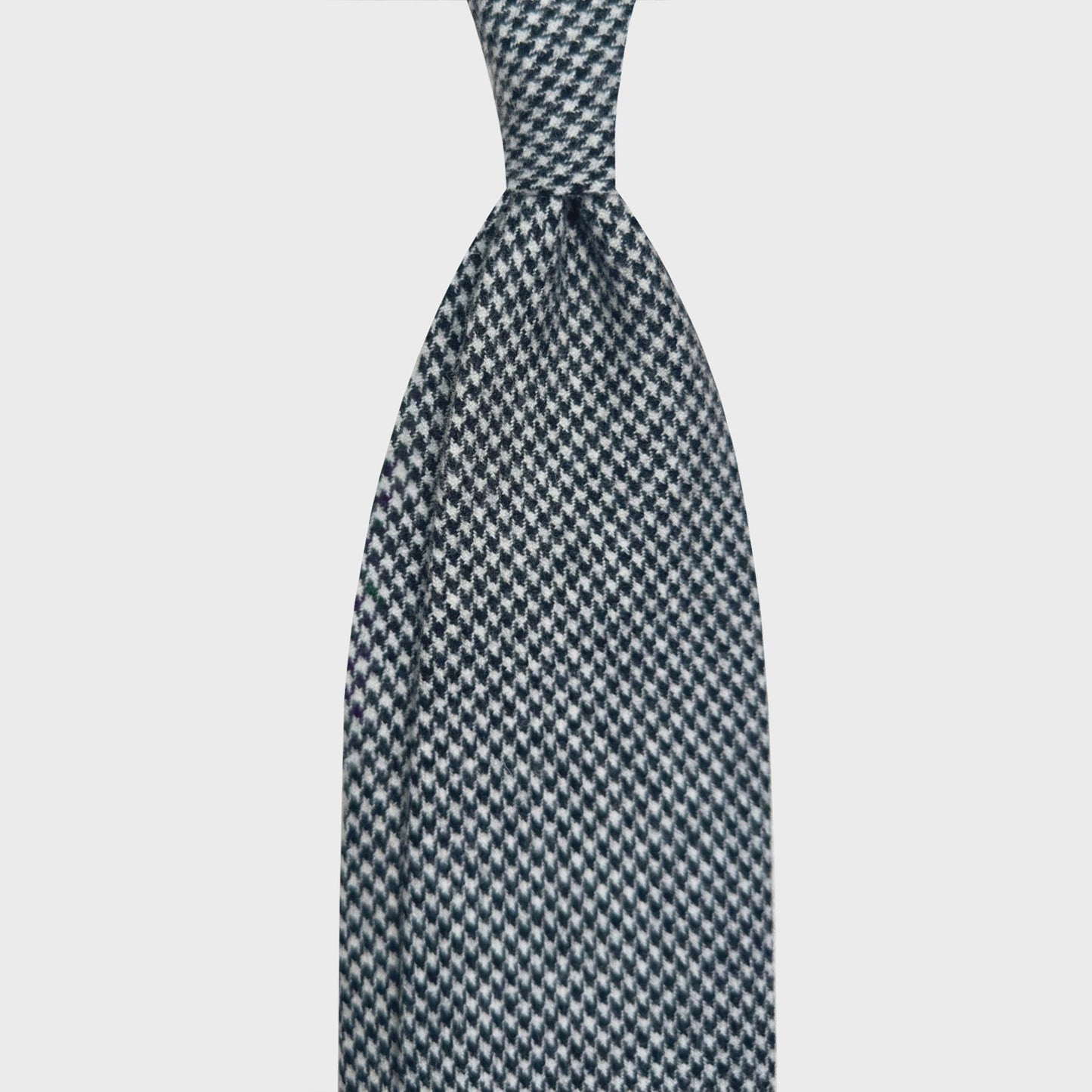 Classic Black White Pied de Poule Tie Hand Made in Italy. Timeless black white pied-de-poule wool tie, unlined tie handmade in Italy ties available at men's neckties store Geneva Switzerland