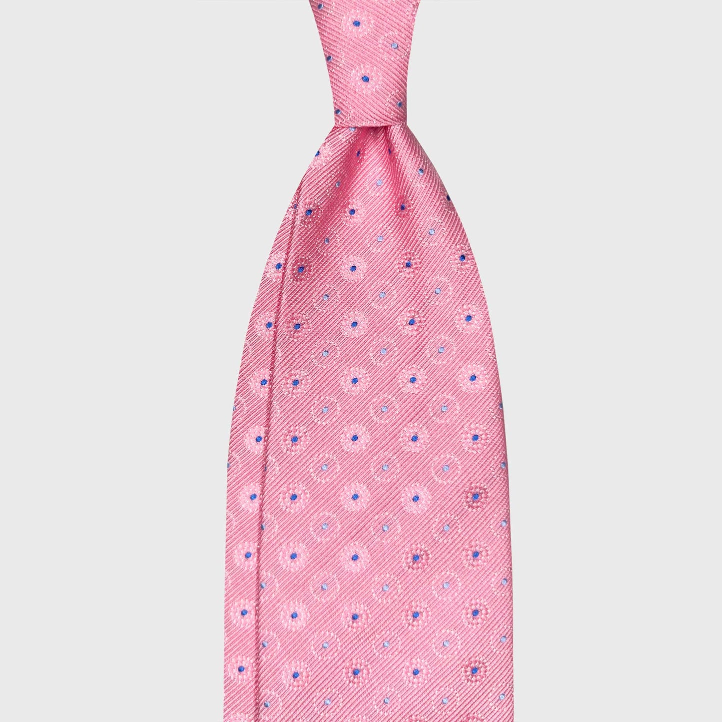 Light Pink Silk Tie Blue Medallion Handmade Italy. Light pink silk tie with refined blue medallion pattern, handmade in Italy. Elegant and versatile tie at Wools Boutique Uomo Geneva.