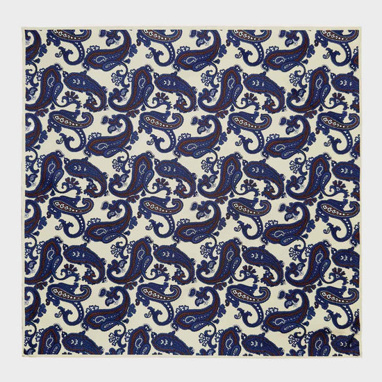 Load image into Gallery viewer, Ivory White Silk Pocket Square Paisley Pattern. Men&amp;#39;s paisley pocket square made with soft silk and with rolled edge, ivory white background with coffee brown and denim blue paisley pattern, ideal for a refined men&amp;#39;s outfit
