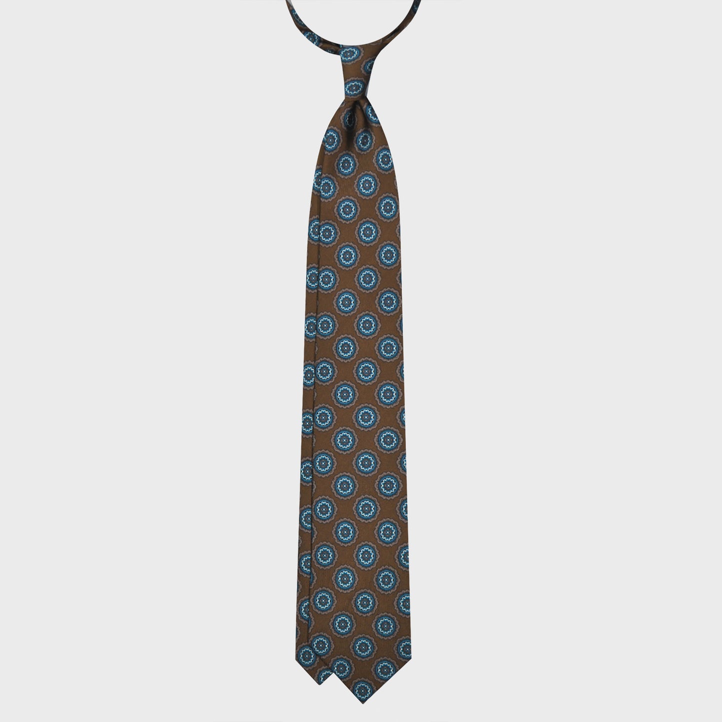 Load image into Gallery viewer, Bronze Brown Medallions Silk Tie. Men&amp;#39;s brown silk tie made with finest Italian silk soft to the touch, unlined tie 3 folds, refined medallions printed pattern turquoise and beige, classic handmade tie F.Marino Napoli exclusive for Wools Boutique Uomo
