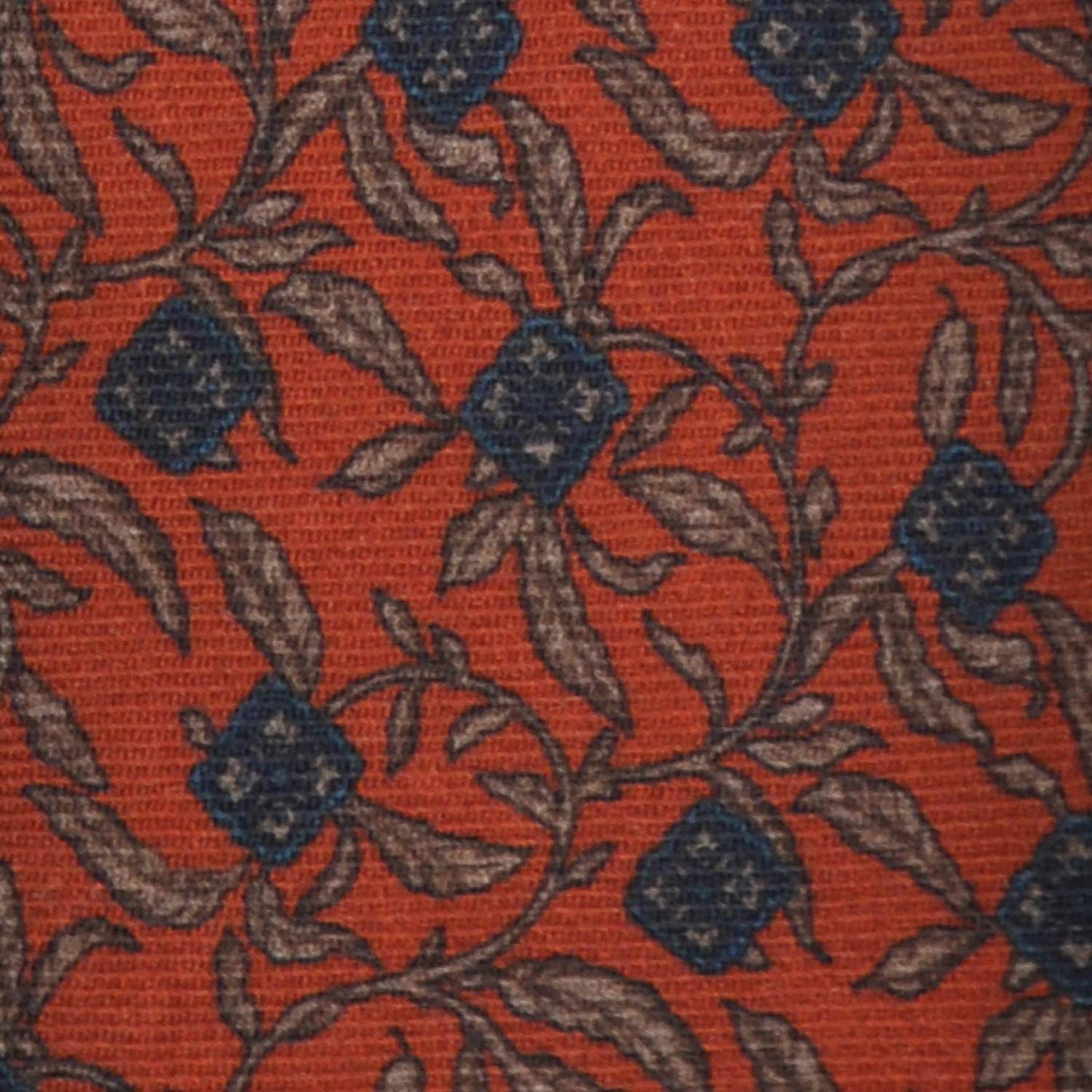 Orange Wool Tie Liberty Flowers Printed. Men's orange tie made with finest Italian wool soft fabric to the touch, unlined tie 3 folds, regular knot, blue and beige flowers liberty pattern
