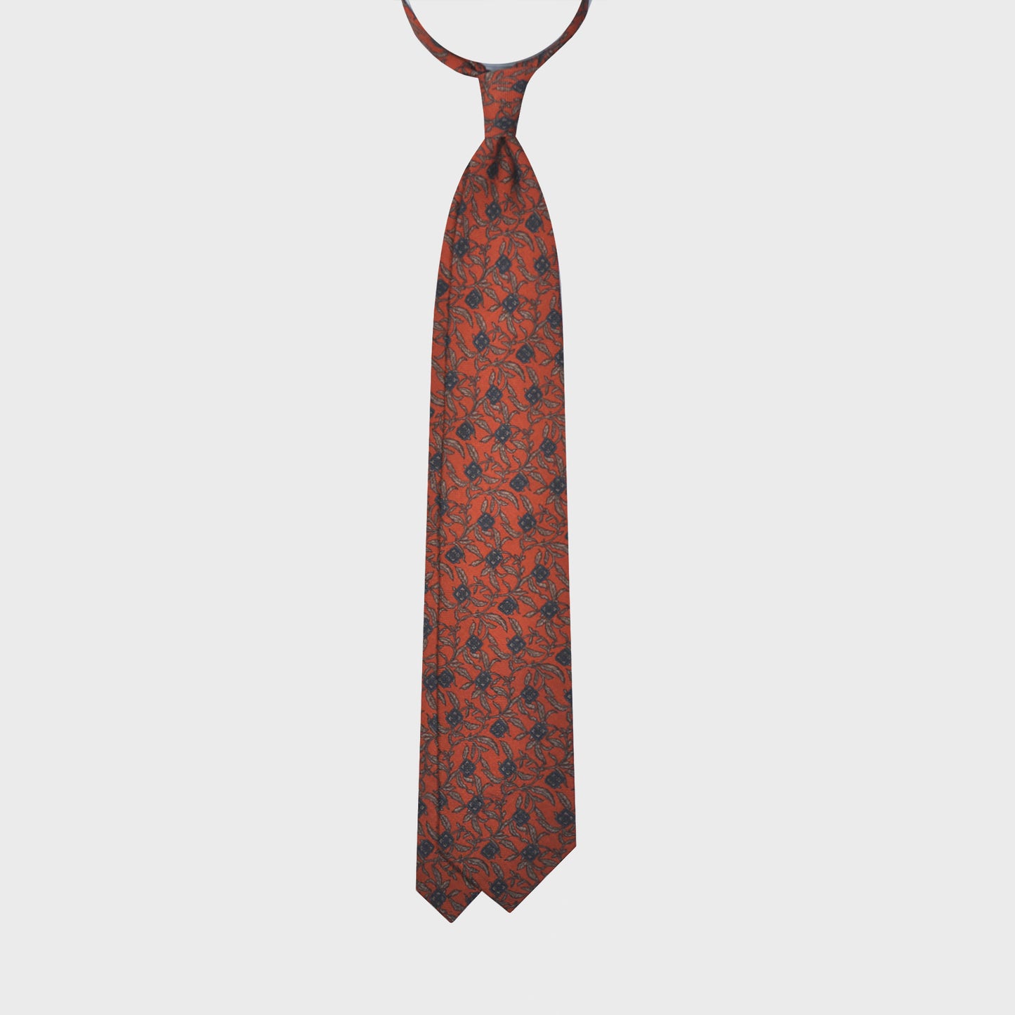 Orange Wool Tie Liberty Flowers Printed. Men's orange tie made with finest Italian wool soft fabric to the touch, unlined tie 3 folds, regular knot, blue and beige flowers liberty pattern