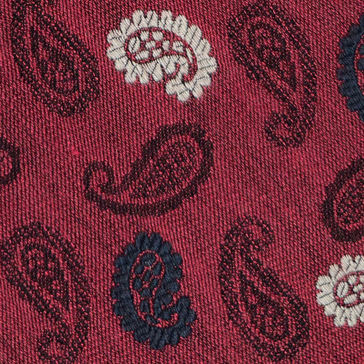 Detail of burgundy red paisley silk wool tie handmade in Italy