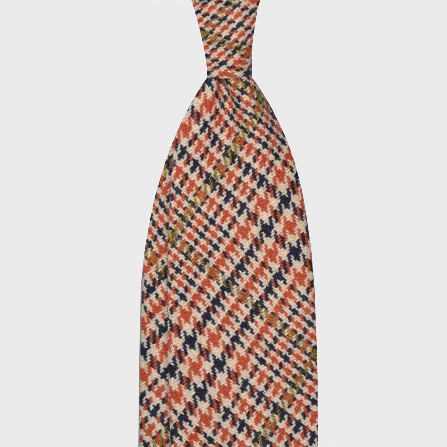 Load image into Gallery viewer, Orange Tweed Tie Handmade Unlined Houndstooth Pattern. Houndstooth tweed wool tie, F Marino ties for Wools Boutique Uomo, light tweed soft texture to the touch, 3 folds, orange, navy blue, olive green houndstooth pattern
