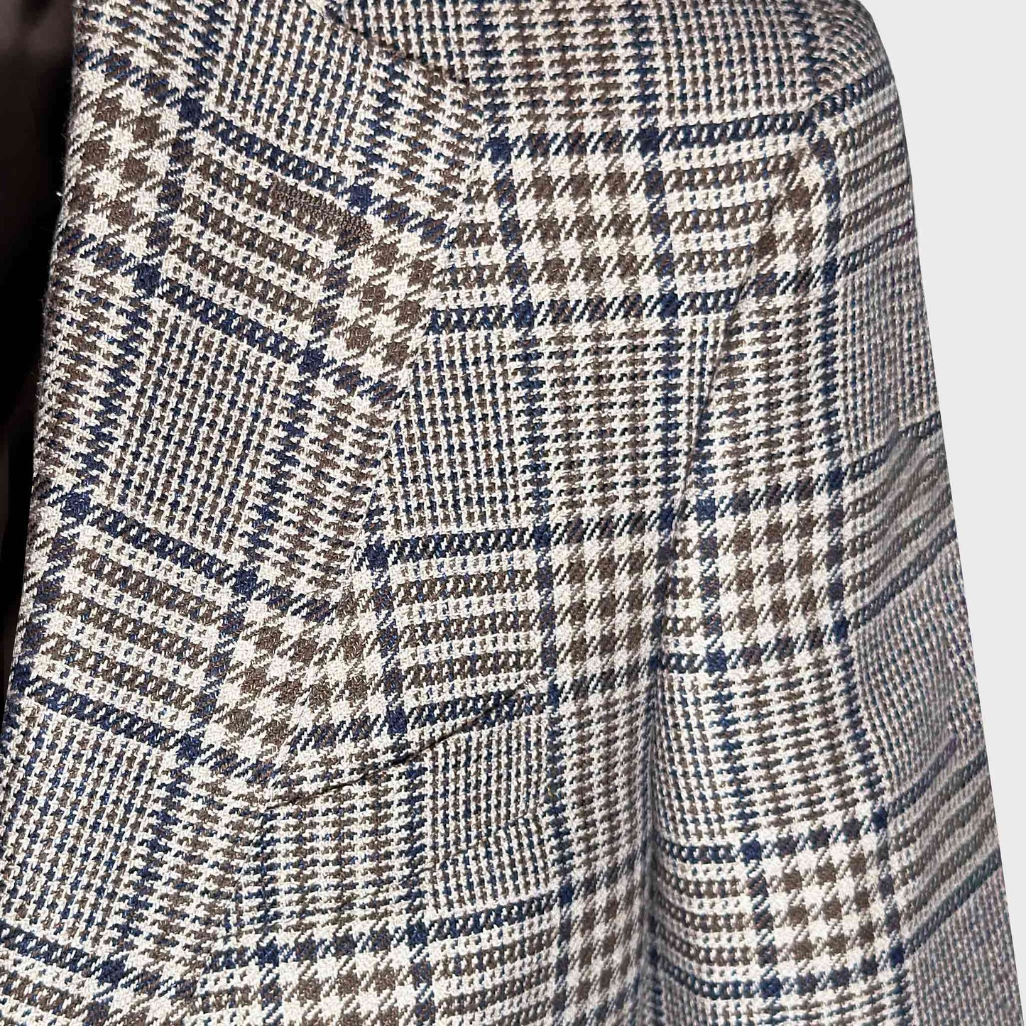 Detail of Marling and Evans Prince of Wales wool silk linen fabric with denim blue overcheck.