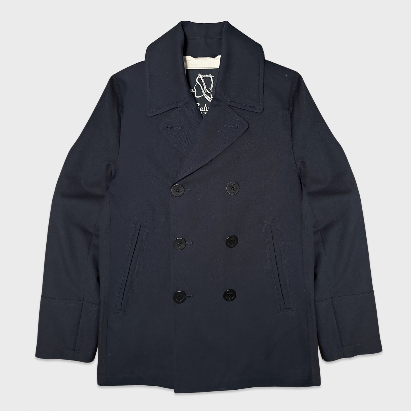 Sealup Amalfi cotton piqué peacoat in navy blue. Italian made double-breasted naval jacket with vintage Sailor Tattoo Pin-Up lining.