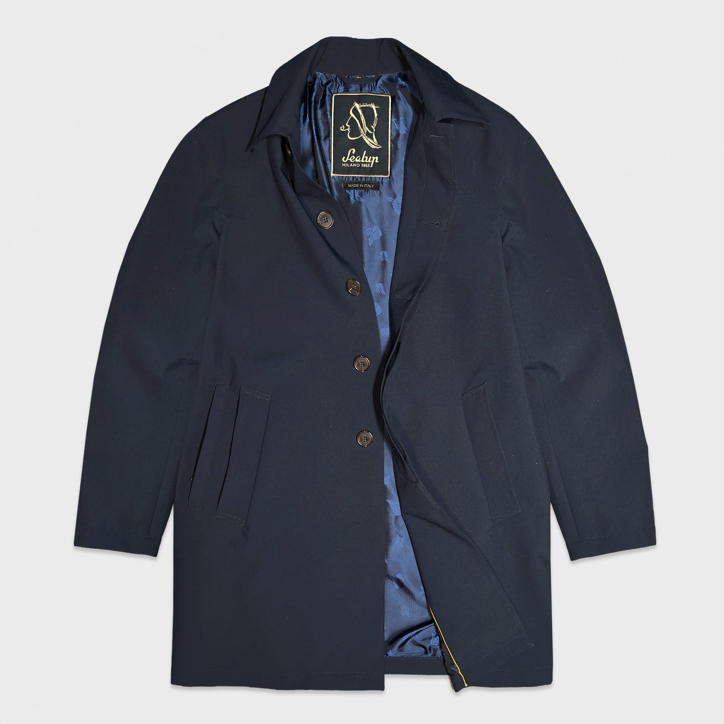 Italian crafted Sealup raincoat in exclusive Hurricane performance fabric. Elegant navy city raincoat designed for business travel, commuting and refined urban style.