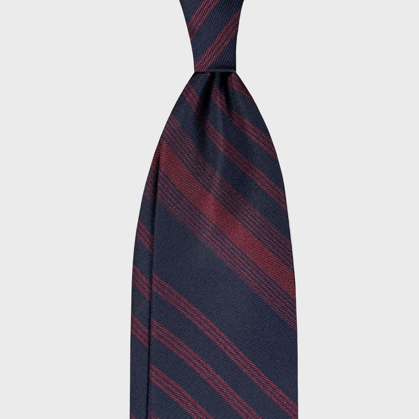 Discover classic regimental ties at Wools Boutique Uomo Geneva. This F.Marino silk tie in navy blue and red is made in Italy and perfect for business and professional tailoring.