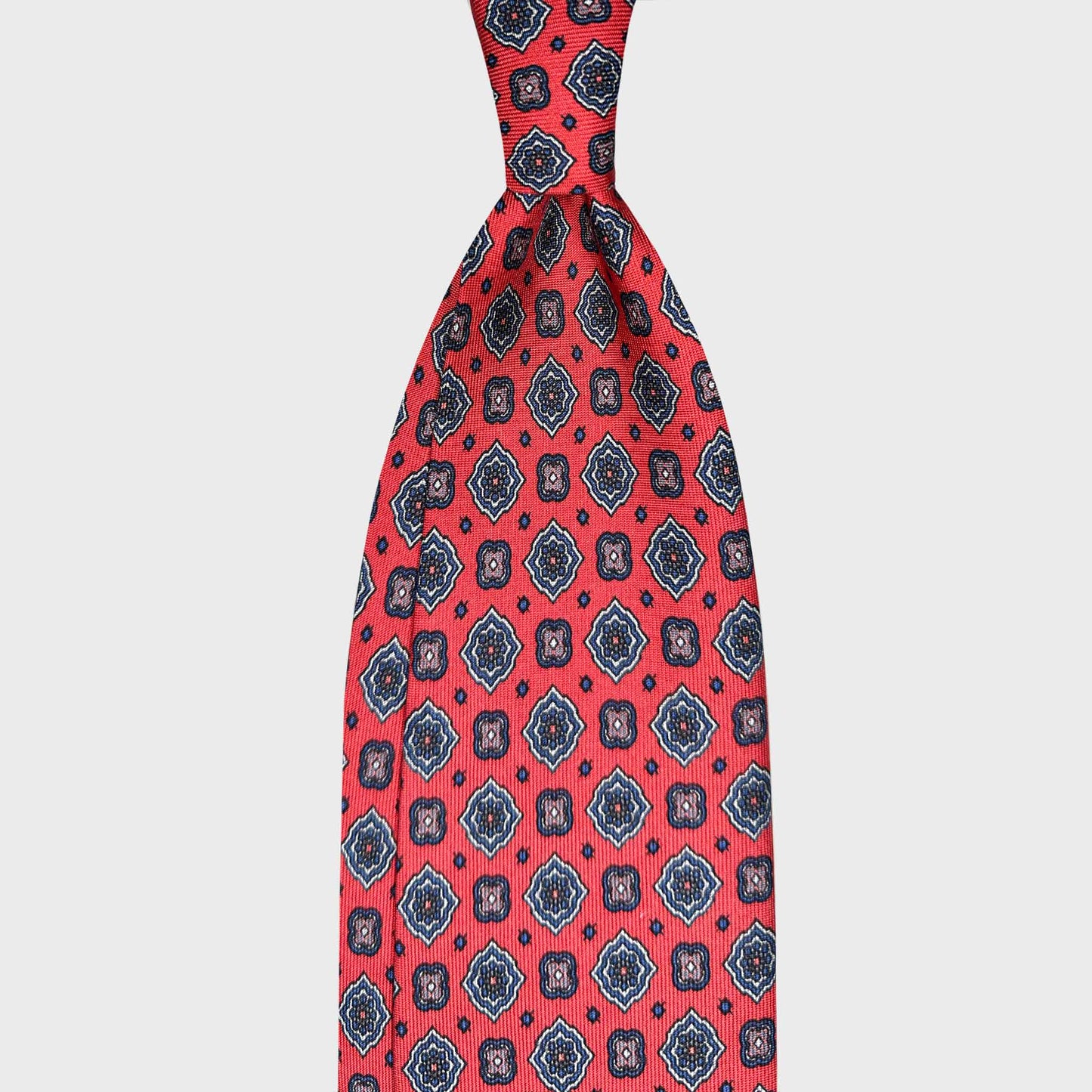 Crimson Red Silk Tie Diamonds Pattern Handmade in Italy. Bright and shiny crimson red silk tie with refined diamonds pattern, handmade in Italy and curated by Wools Boutique Uomo Geneva.