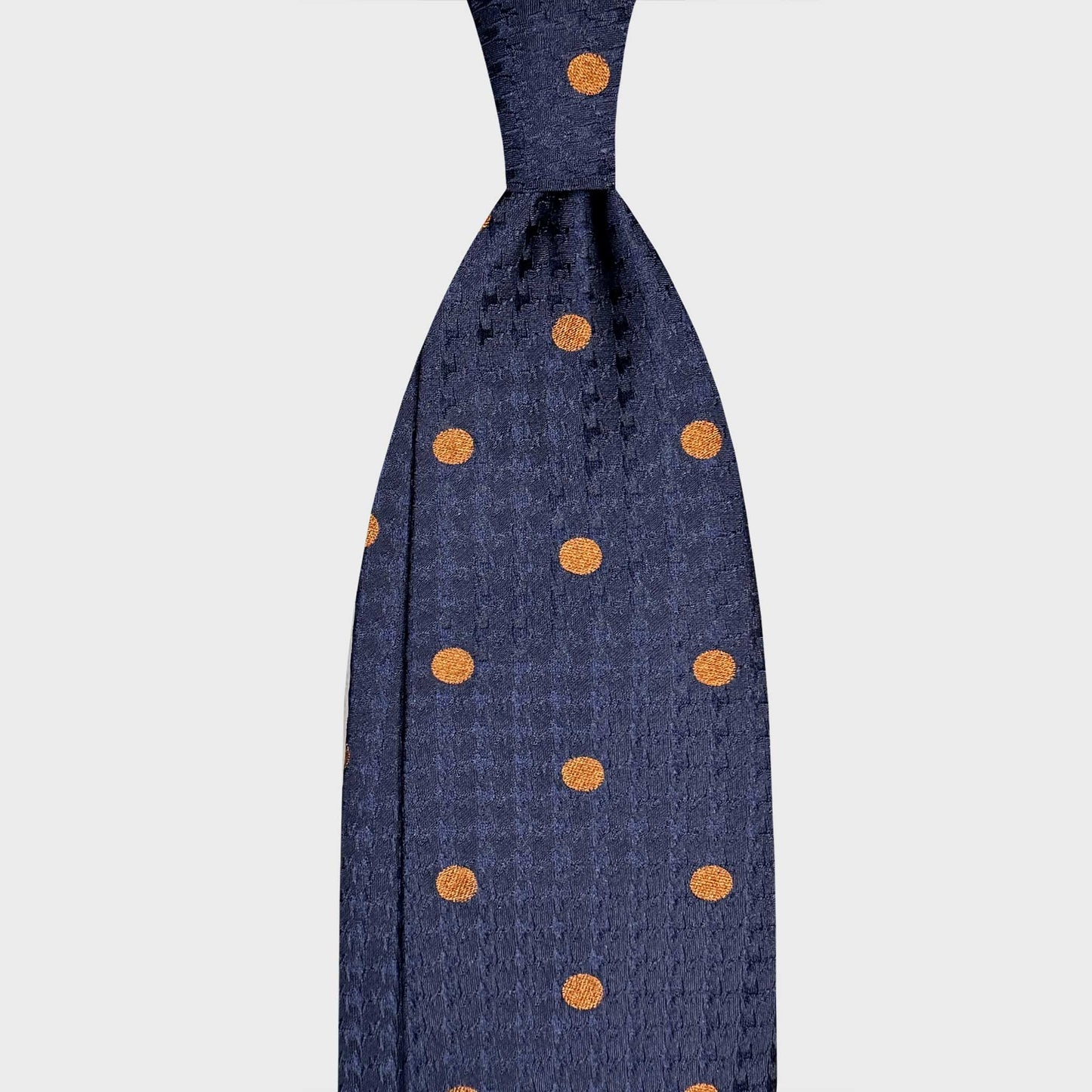 Cobalt Blue Bold Pois Tie Men's Ties Geneva. Refined cobalt blue silk tie with bold copper-orange polka dots and textured jacquard weave. Handmade in Italy and selected by Wools Boutique Uomo, Geneva.