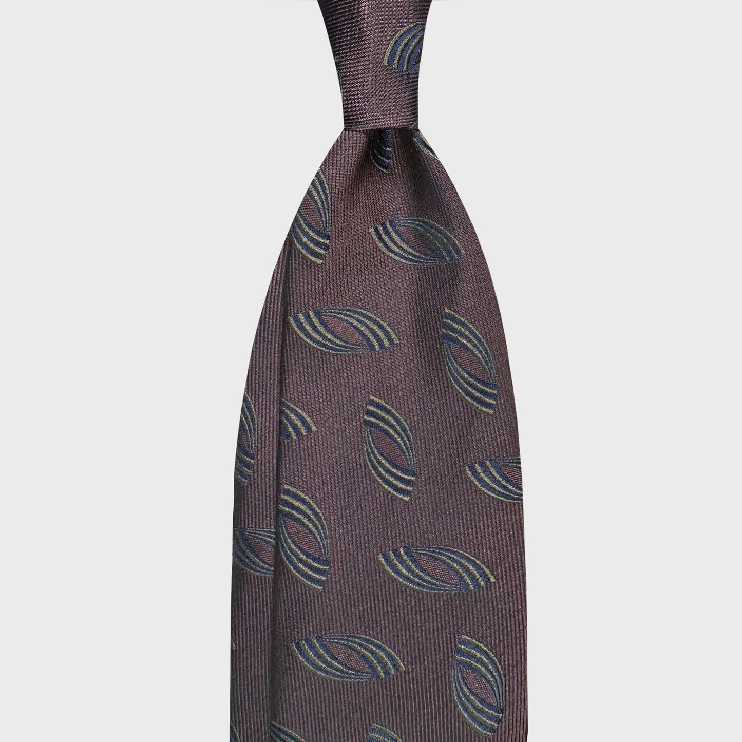 Coffee brown silk tie featuring a minimal Art Deco motif embroidered in lime green and navy blue. A refined Italian design ideal for elegant business attire and contemporary sartorial styling.