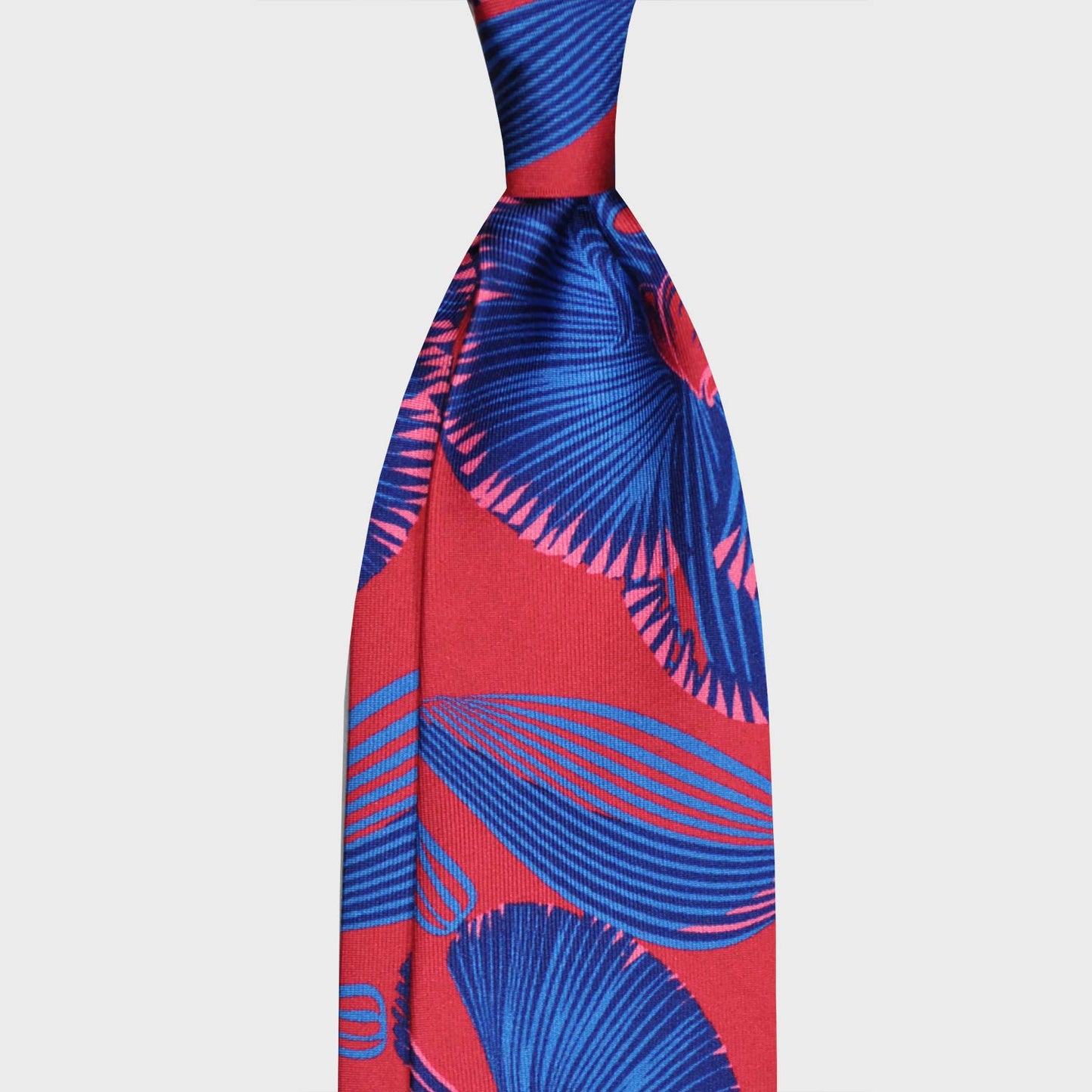 Magenta Red Silk Tie 3 Hawaiian Floral Pattern. Refined aloha silk tie floral pattern, hand made in Italy by F.Marino Napoli exclusive for Wools Boutique Uomo, unlined hand rolled edge, magenta red background with electric blue Hawaii flowers pattern
