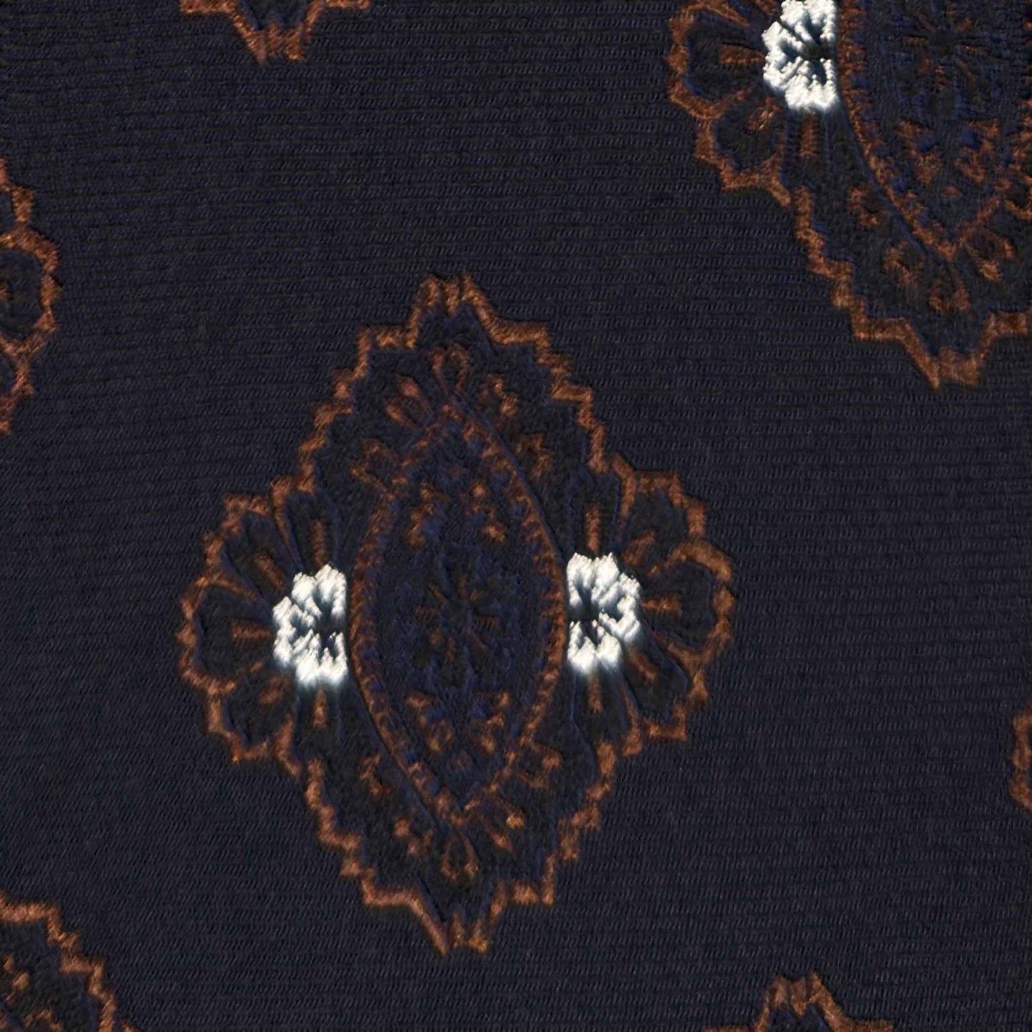 Large brown medallions on dark navy blue silk tie detail